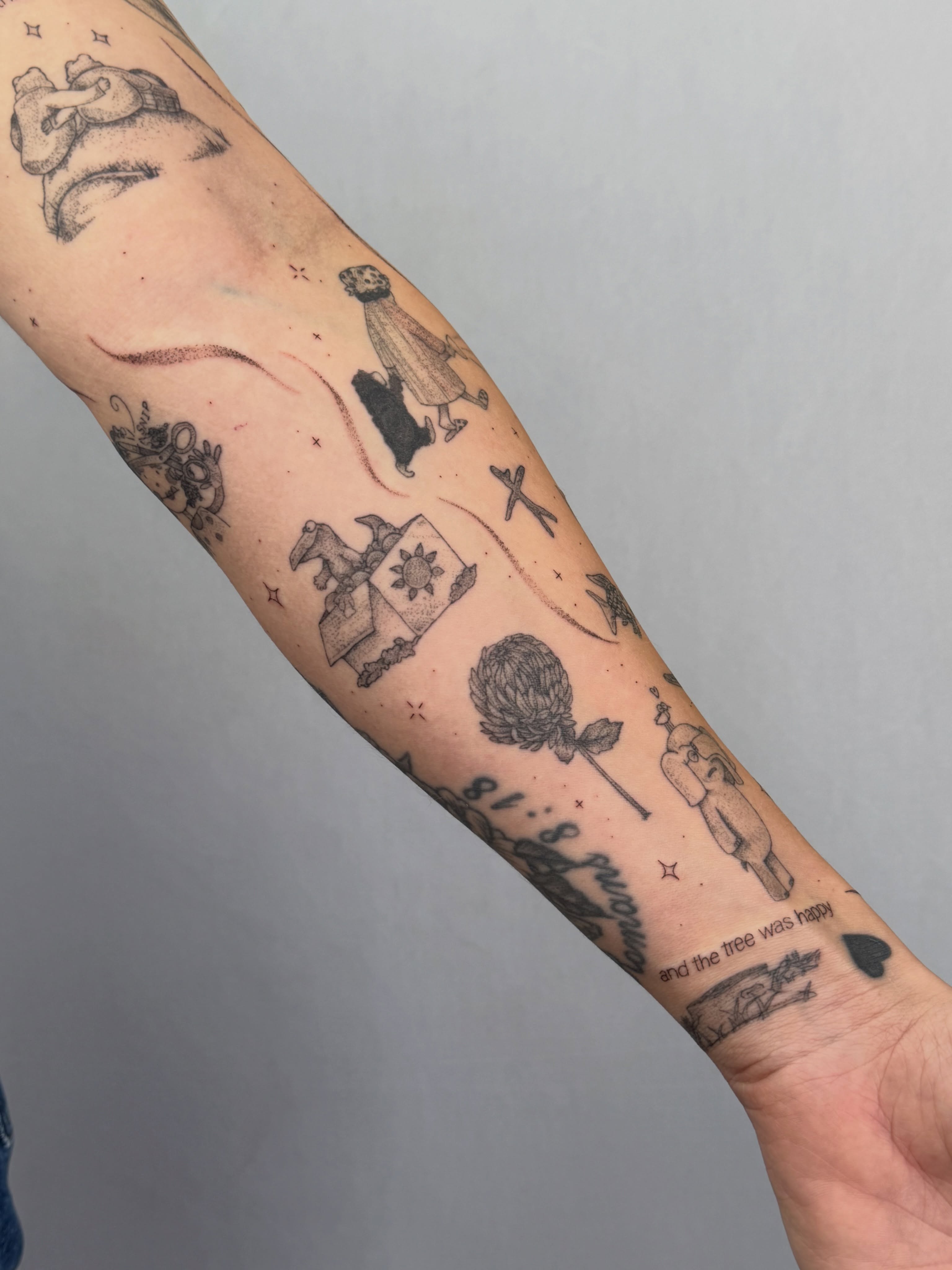 Multiple motifs black and grey tattoo on the forearm by Henesee Parfitt