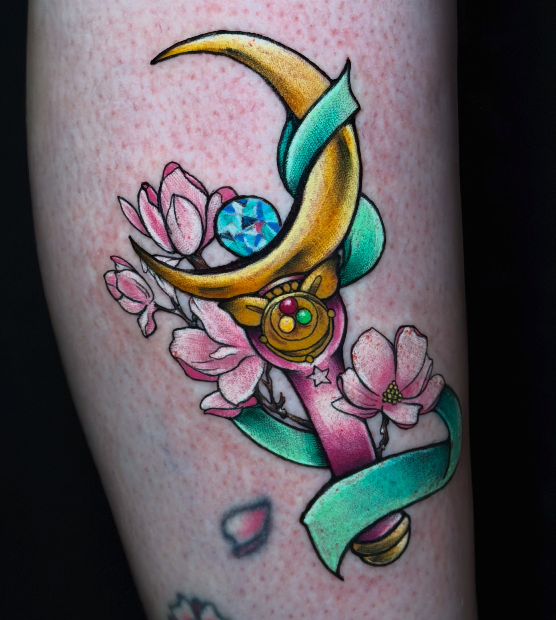 Moon and flowers new school tattoo on the forearm by Breanna Fraielli