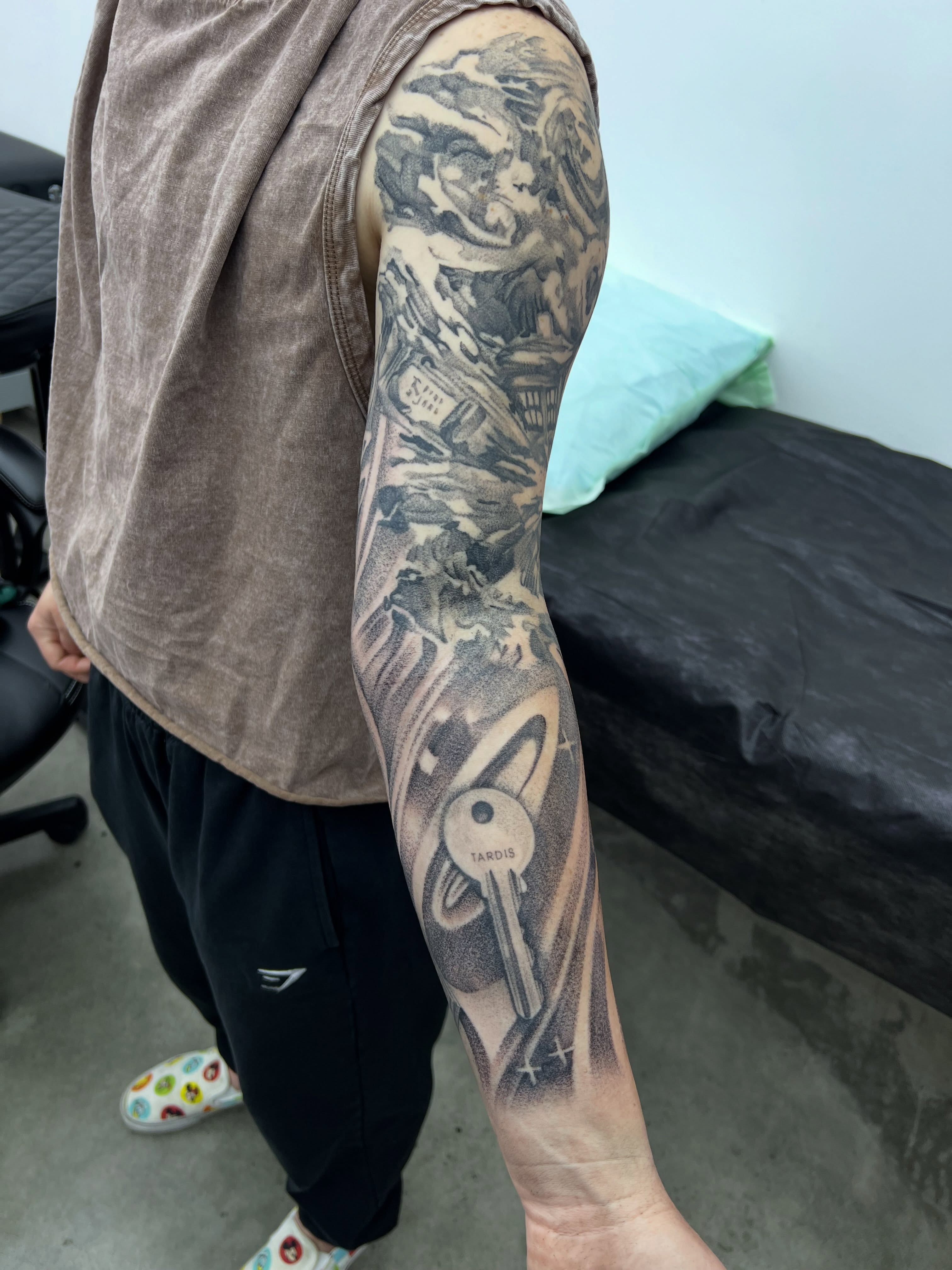 Doctor Who TARDIS realism tattoo on the forearm by Nate Webb