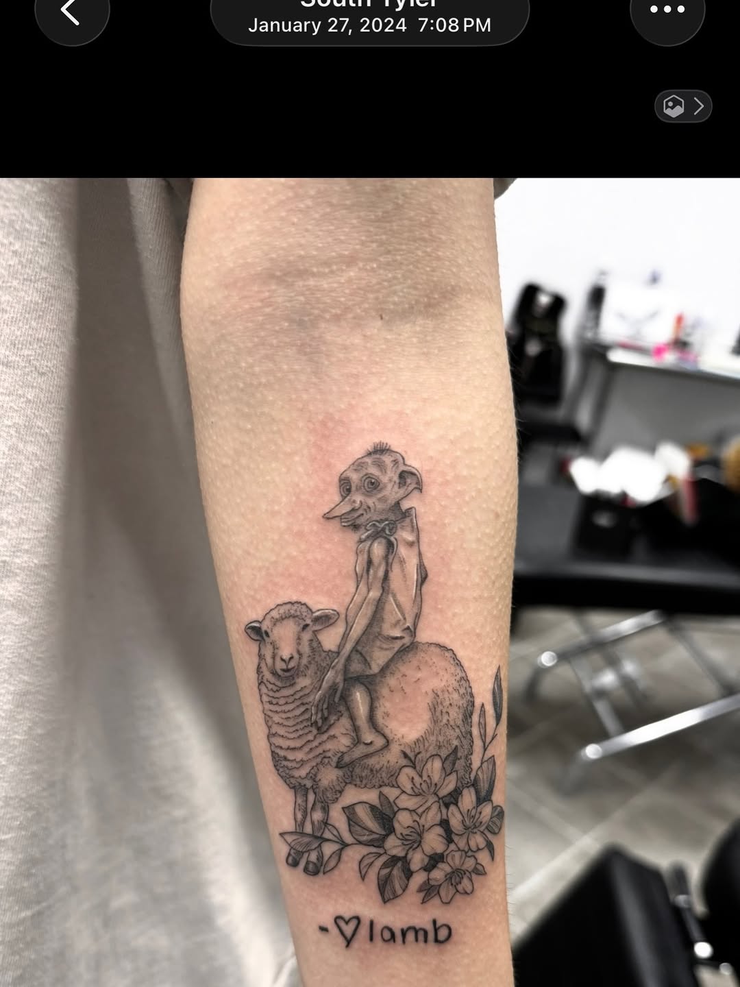 Dobby riding a sheep with flowers fine line tattoo on the forearm by Juan Guzman