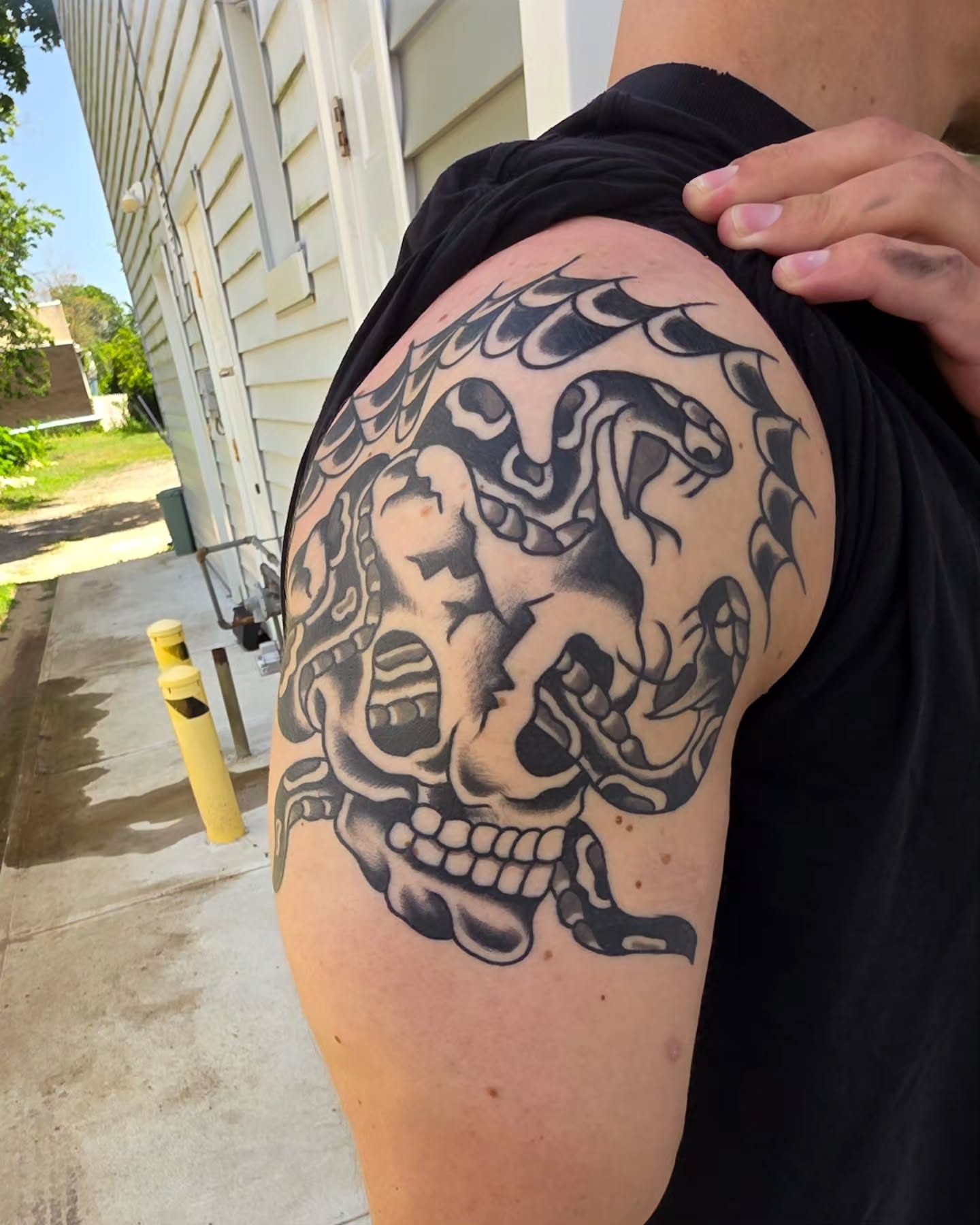 Skull with snakes realism tattoo on the shoulder by J. Kirsch New Jersey Tattoo Artist