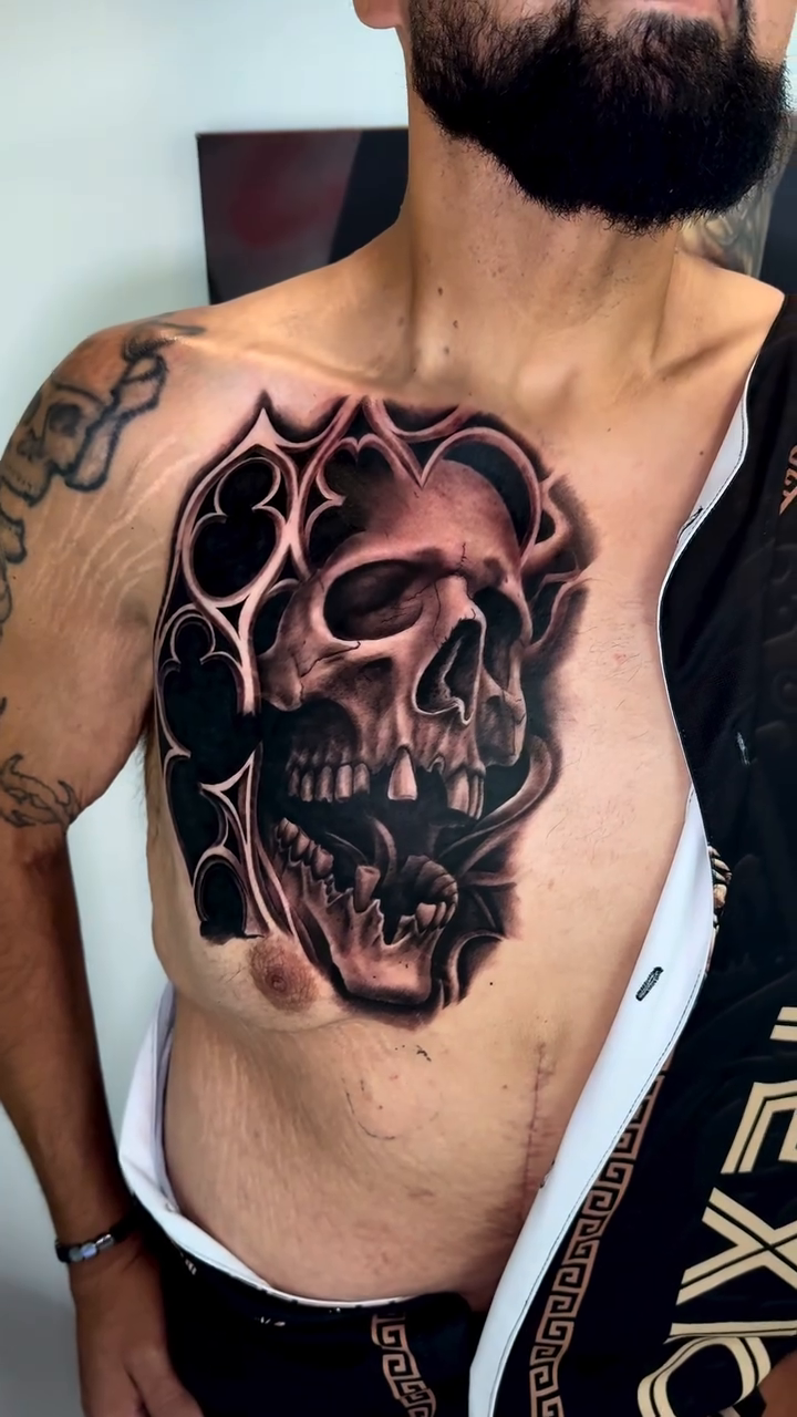 Skull with ornate frame realism tattoo by Brandon Patino
