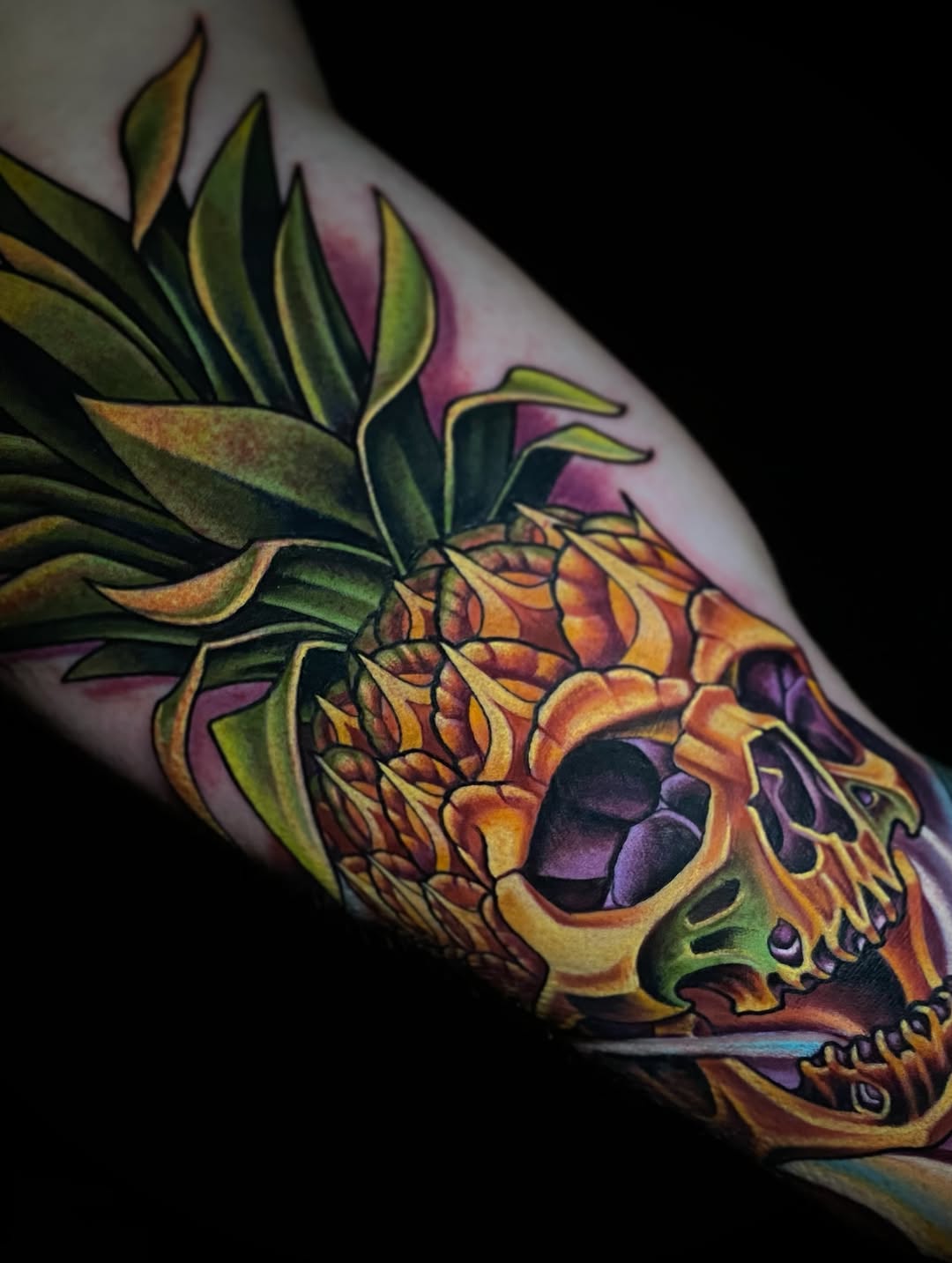 Skull pineapple surrealism tattoo on the forearm by Joshua Orville Vaughn, Kansas City, Missouri