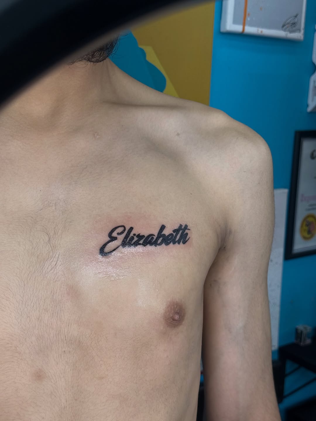 Elizabeth name tattoo lettering tattoo on the chest by ⠀Greave