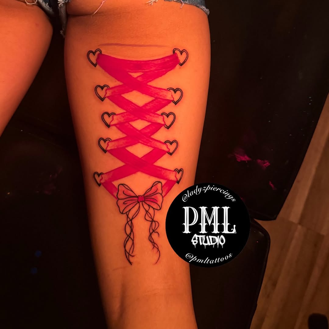 Corset with hearts and bow tattoo on the leg by PMLSTUDIO ✡️ Atlanta Licensed Artist, Decatur, Georgia