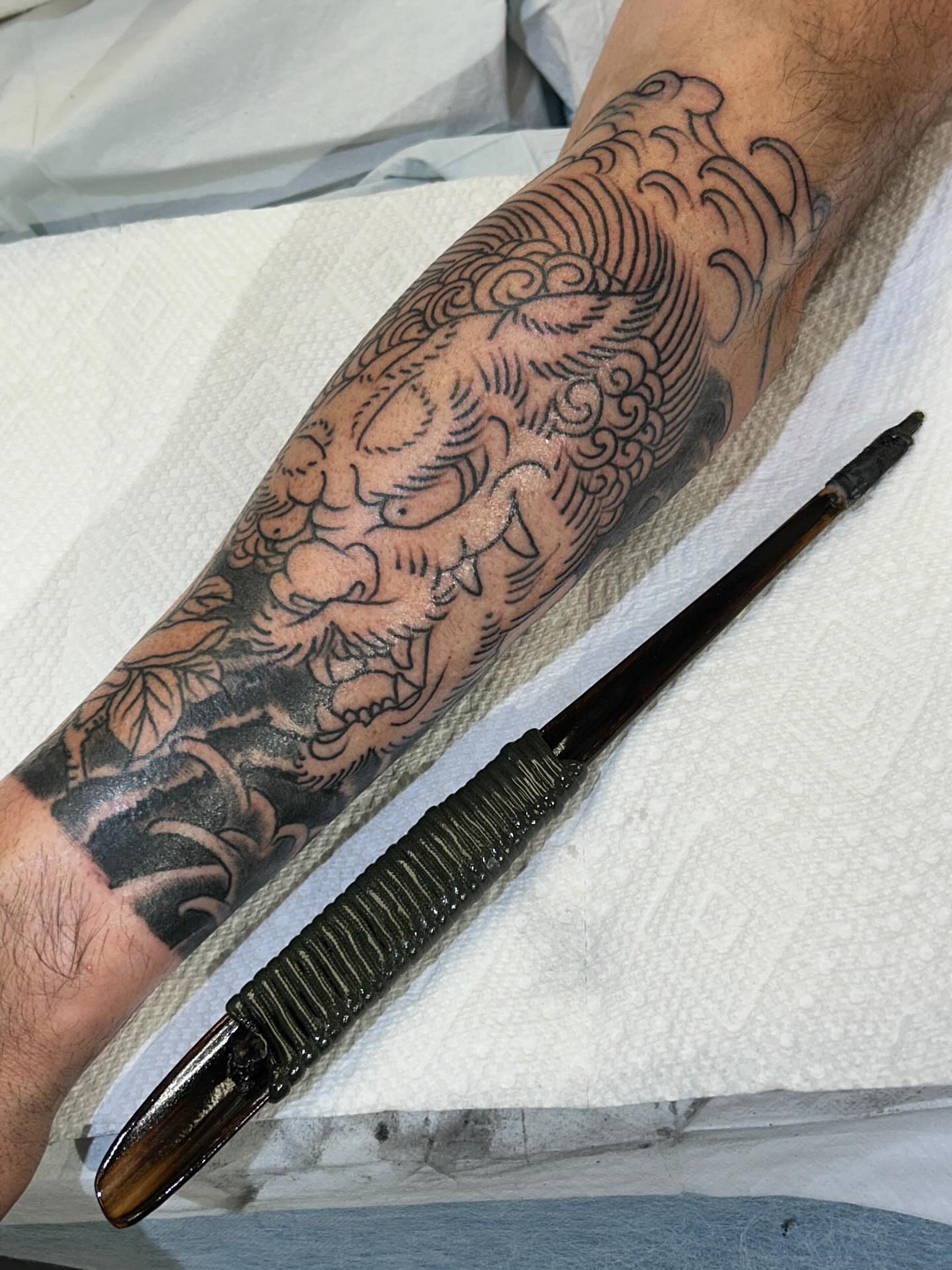 Mythical creature neo-traditional tattoo on the forearm by Jim Rosal