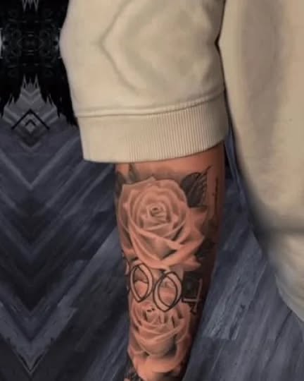Roses and glasses Chicano tattoo on the forearm by Janice Heathcote