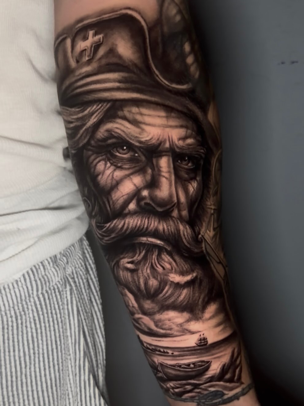 Tattoo by @burkes.body.graphic — realism, black_and_grey
