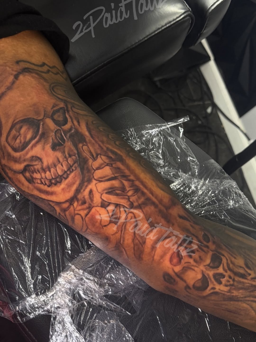 Skull and bones dark art tattoo on the forearm by 2PaidTattz