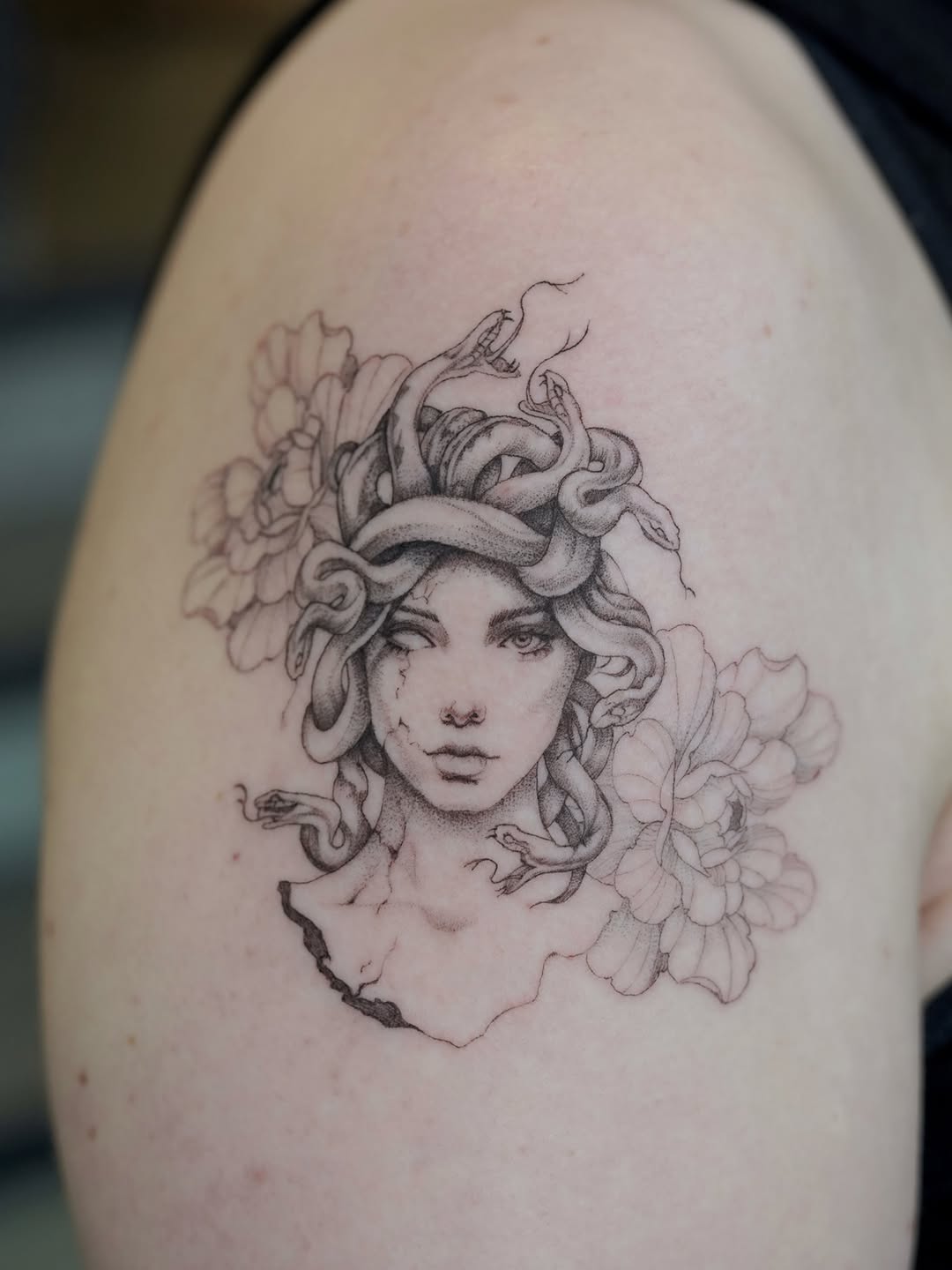 Medusa with snakes and flowers realism tattoo on the shoulder by Julia