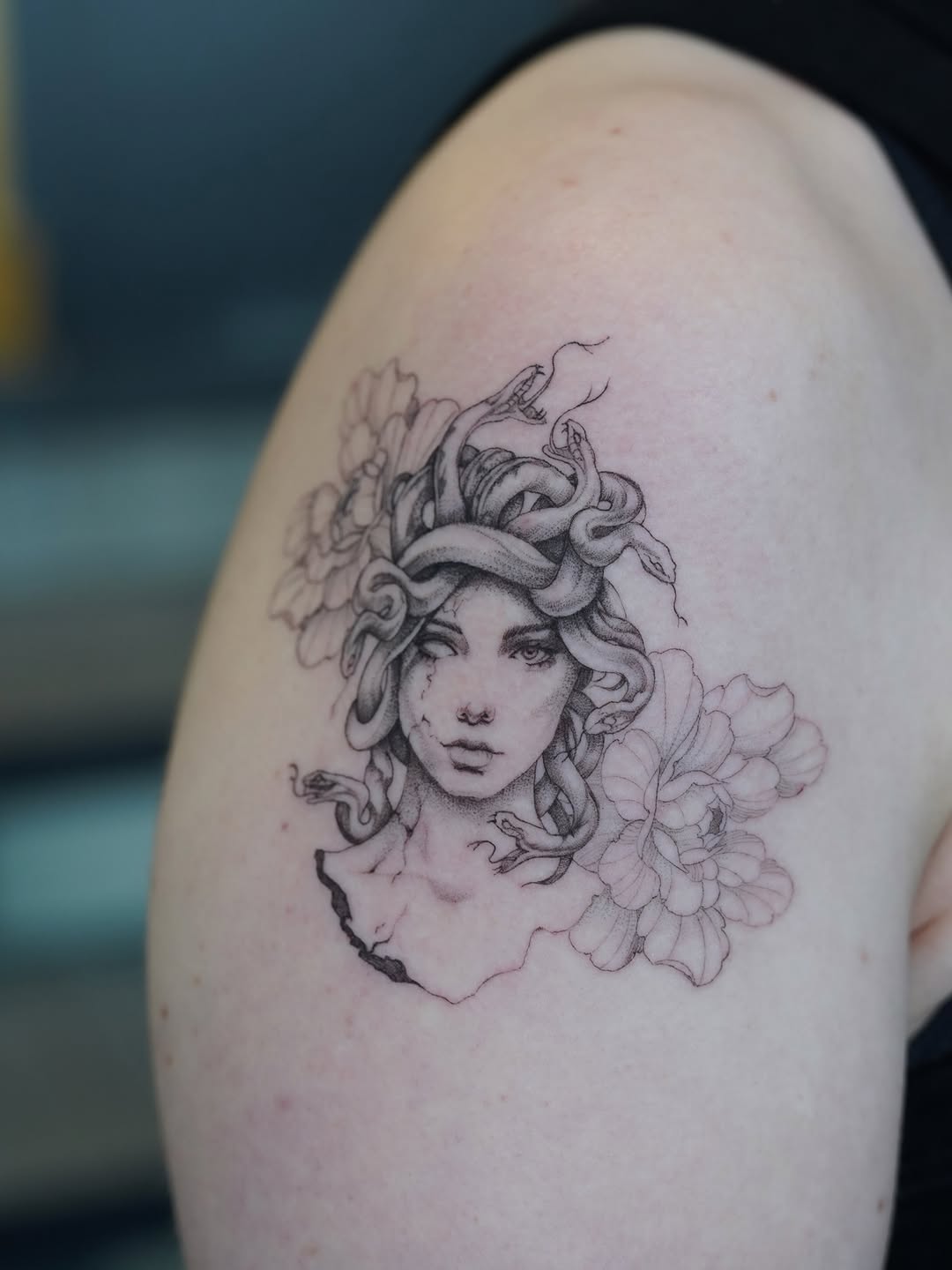 Medusa with snakes and flowers realism tattoo on the shoulder by Julia