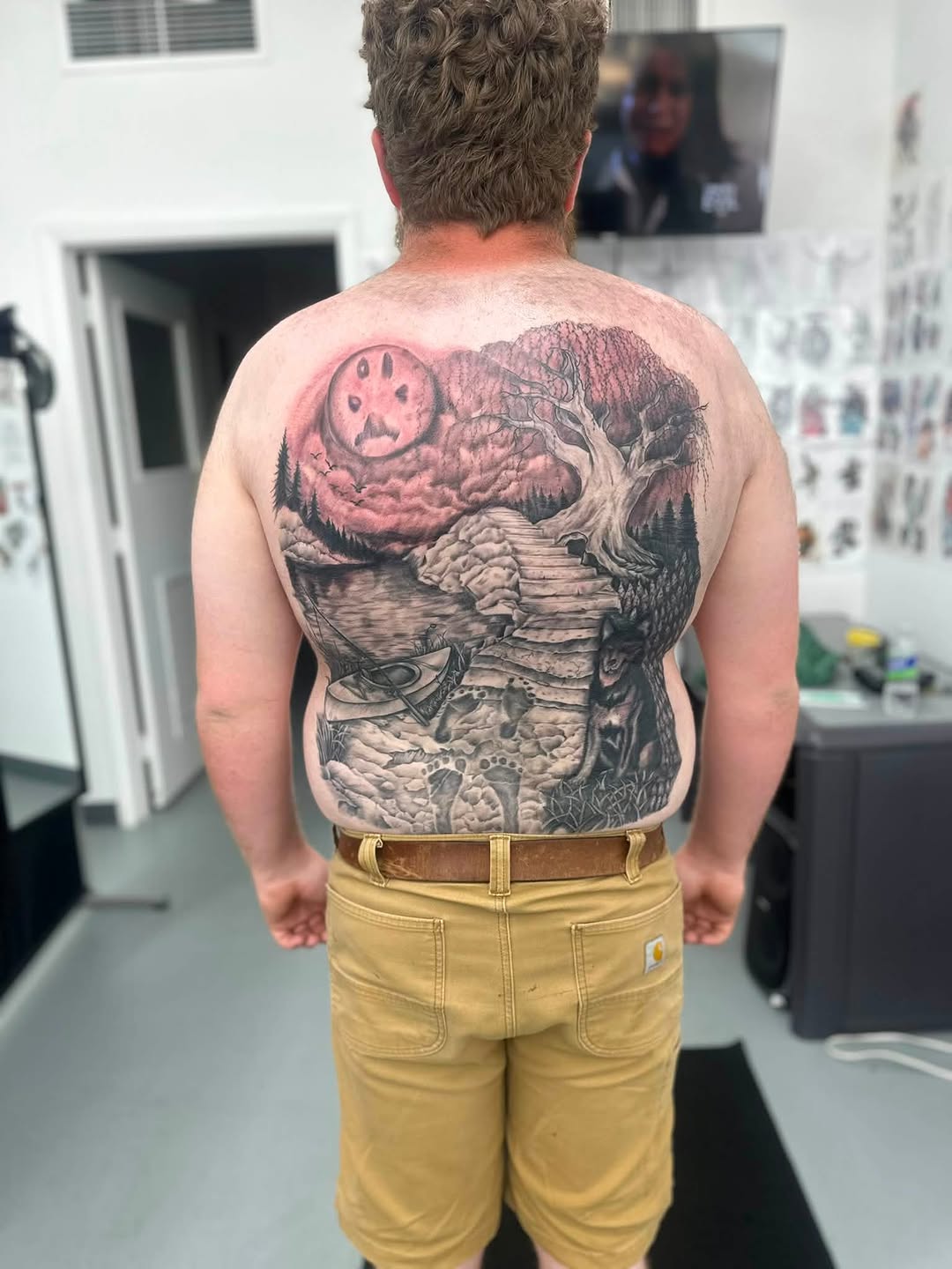 Landscape with moon and tree dark art tattoo on the back by Brian Lambert