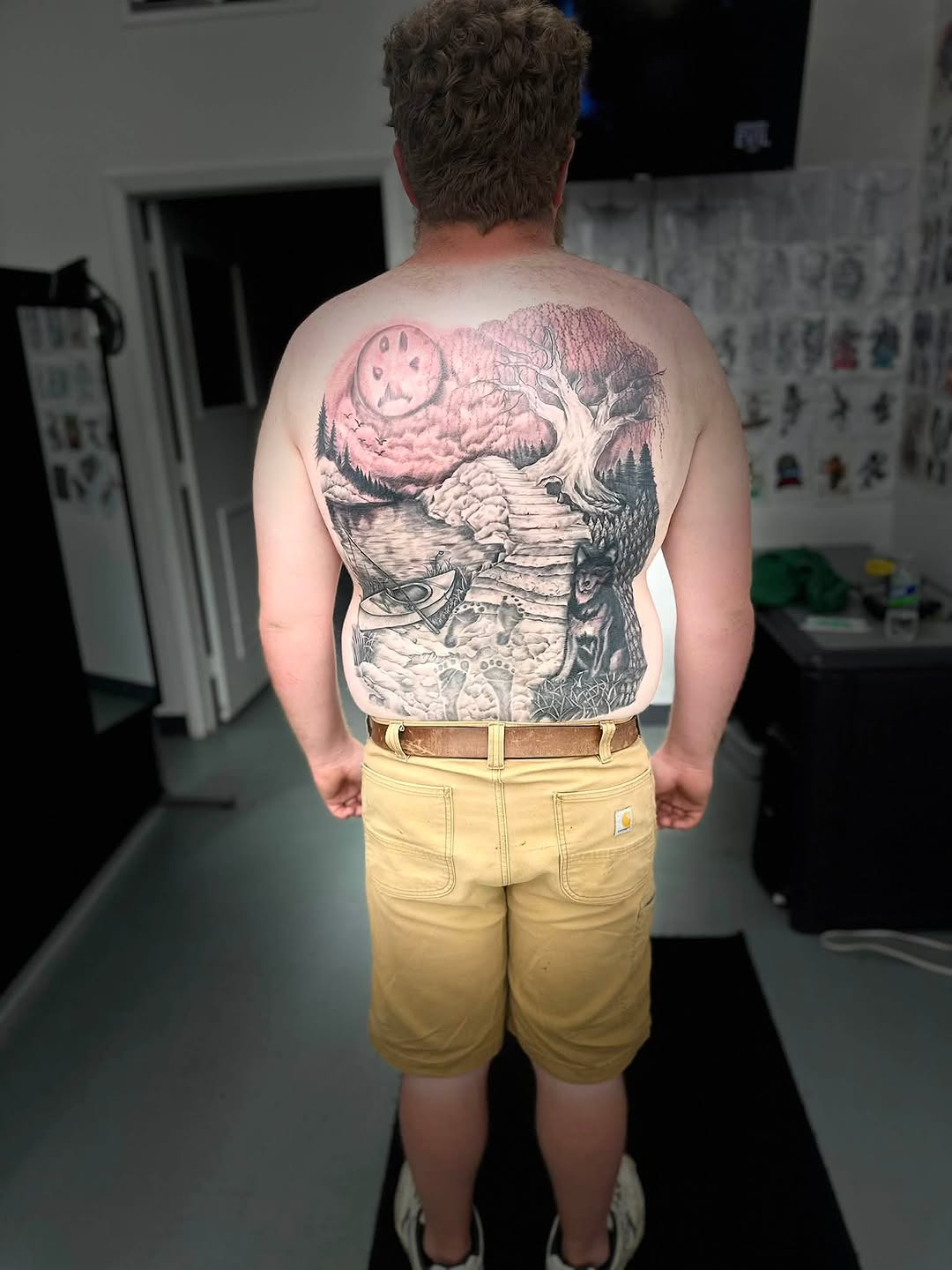 Landscape with wolf and tree dark art tattoo on the back by Brian Lambert
