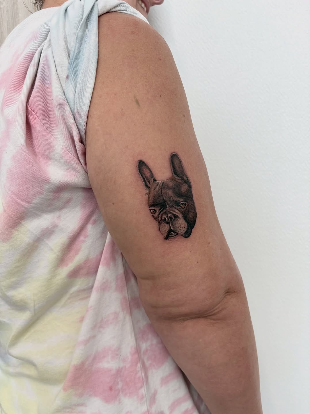 French Bulldog portrait realism tattoo on the upper arm by Deborah