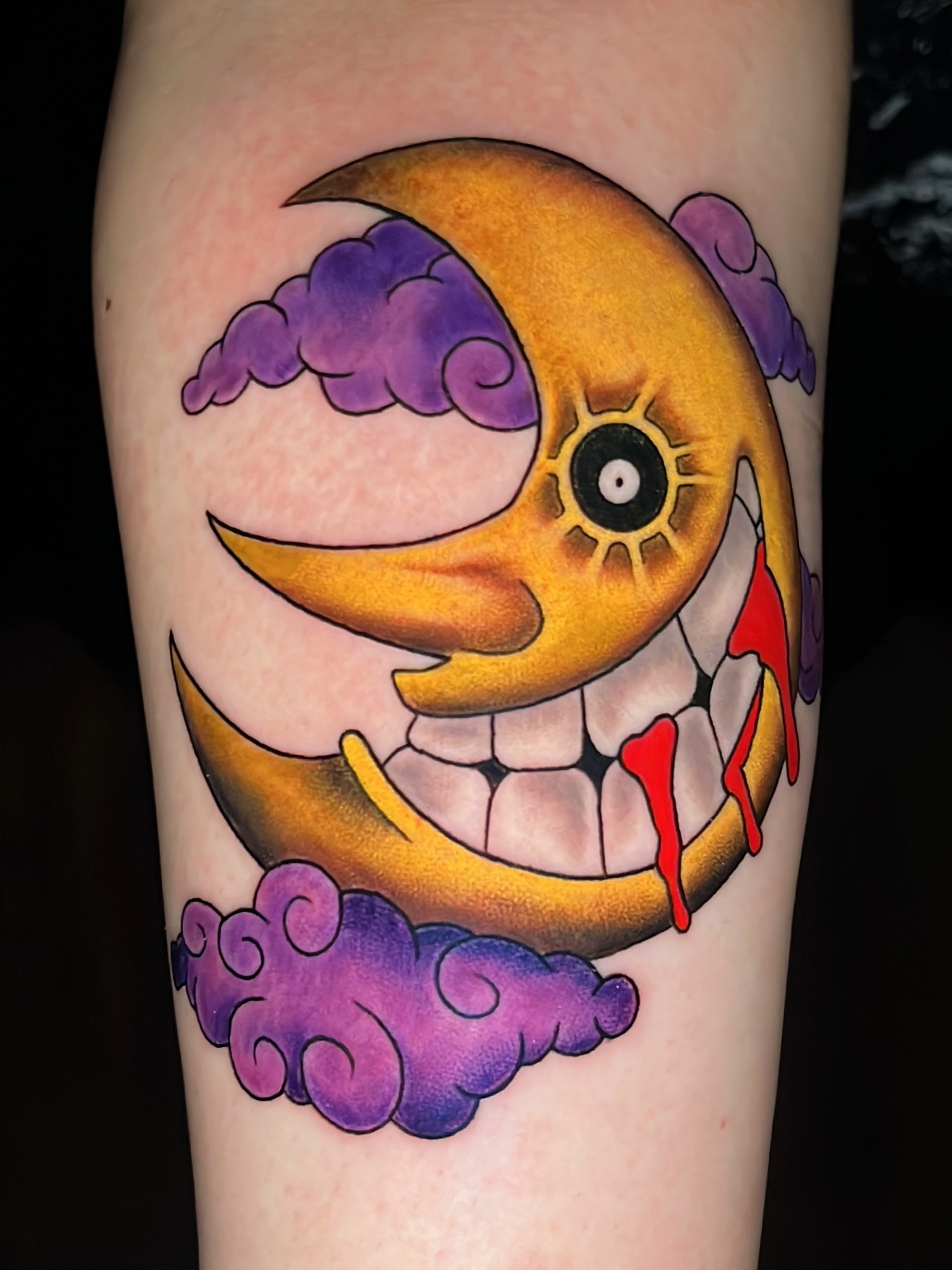 Smiling crescent moon American traditional tattoo on the forearm by Kyle Schneider