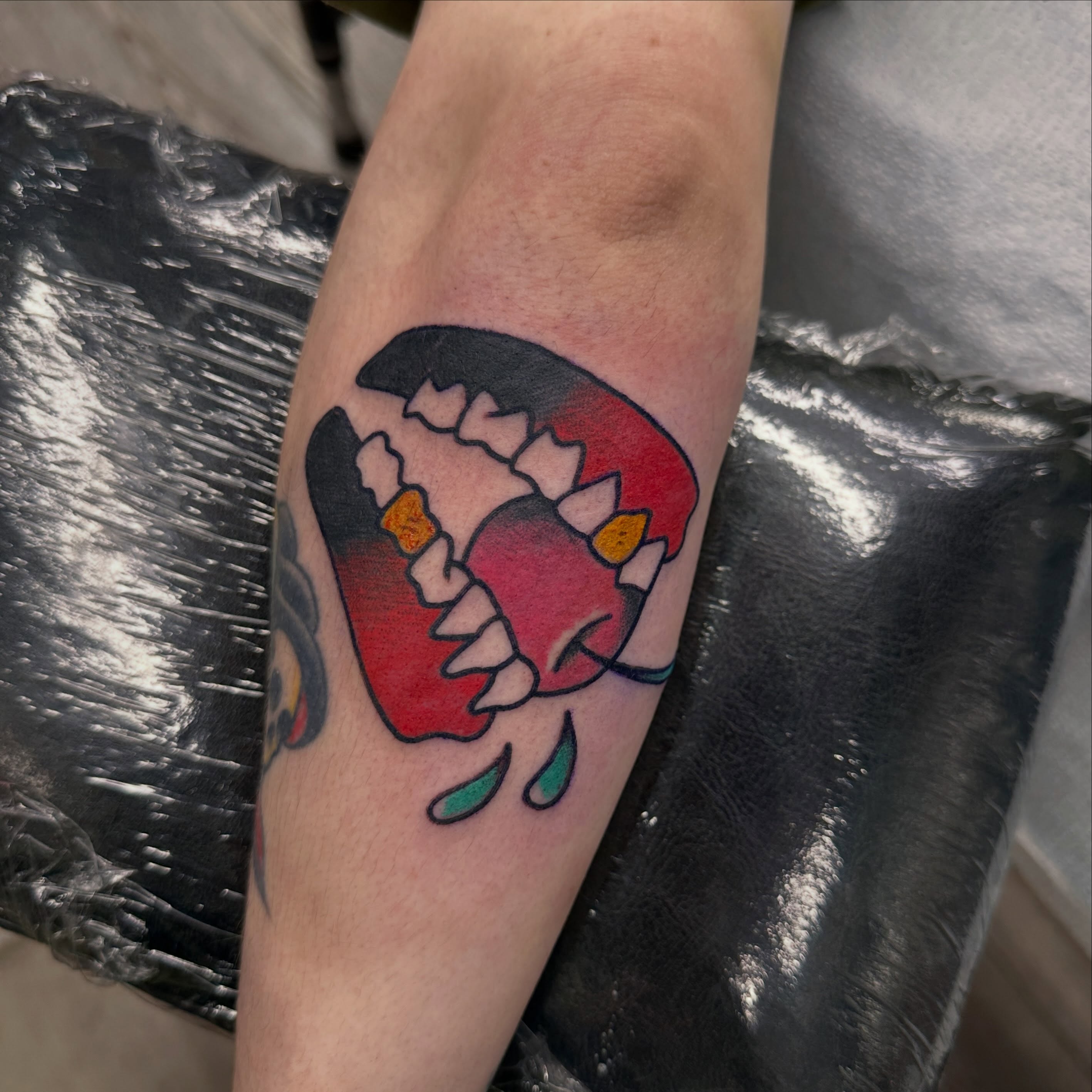 Angry mouth new school tattoo on the forearm by Fil Ponte
