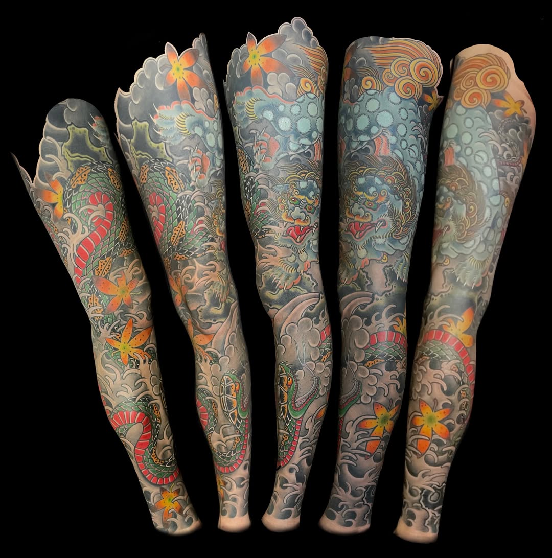 Dragon and foo dog sleeve Japanese tattoo on the upper arm by Mark Thompson, Dallas, Texas