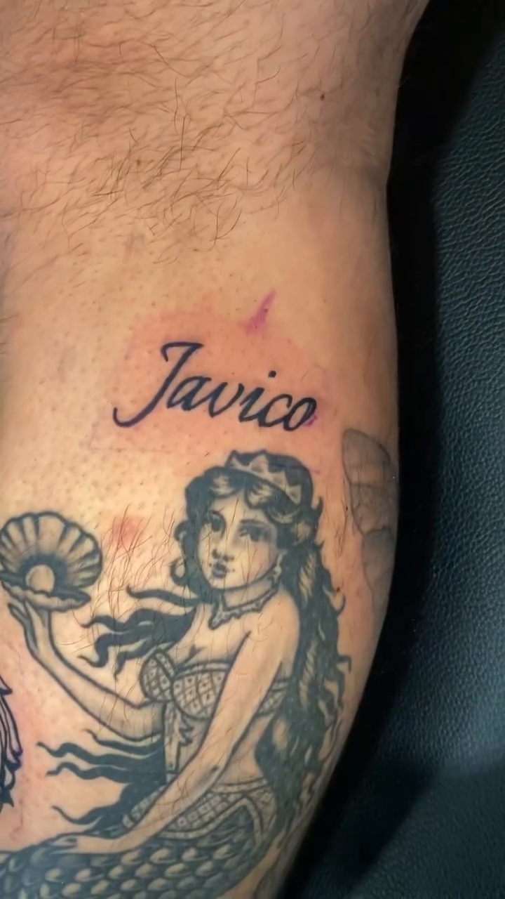Mermaid with name 'Javico' fine line tattoo on the forearm by Ian Dorman