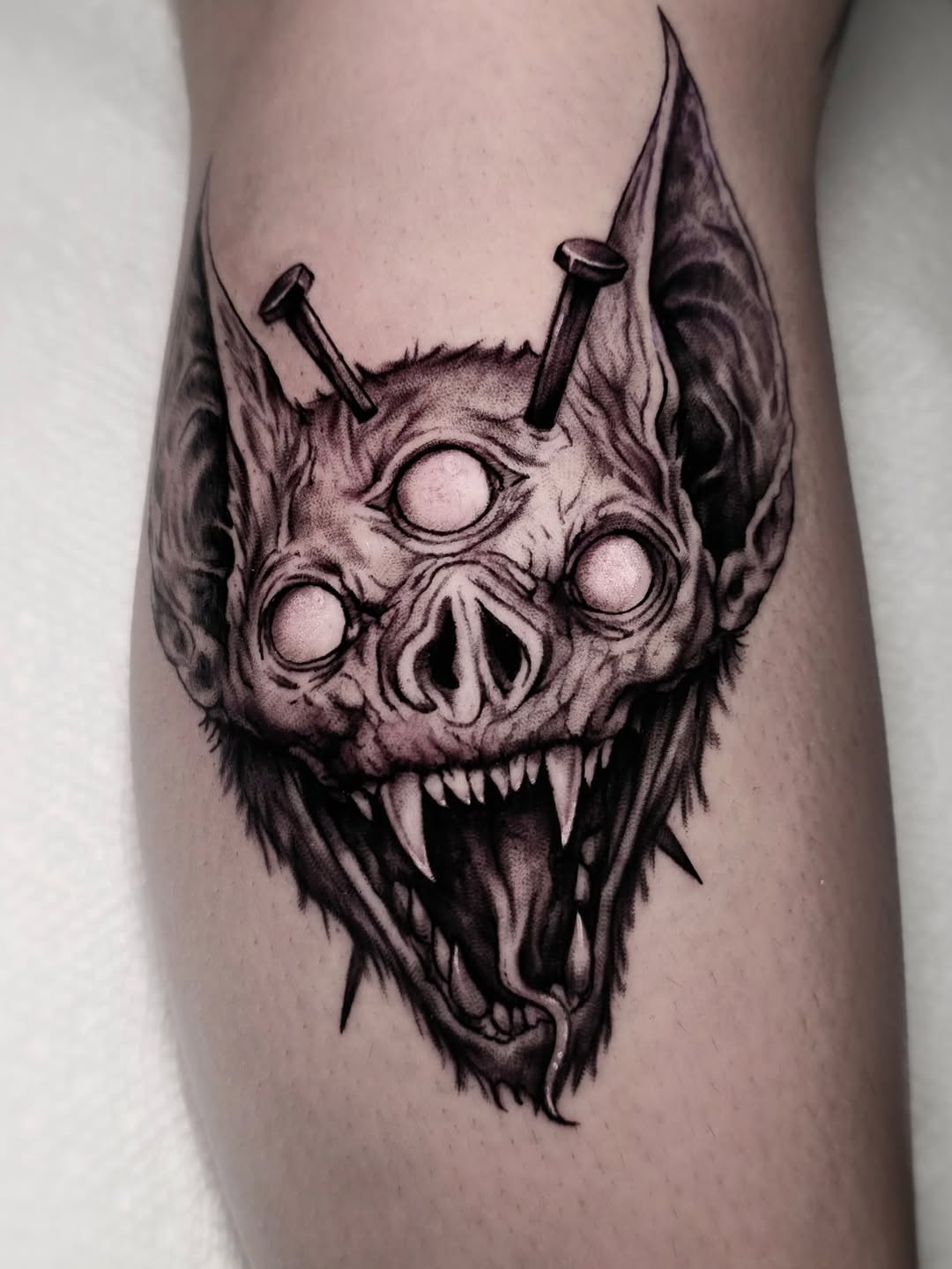 Demonic bat head with nails dark art tattoo on the forearm by ʙʀɪᴀɴɴᴀ 𝒁𝑶𝑴𝑩𝑹𝑰𝑬 ᴛᴀᴛᴛᴏᴏꜱ