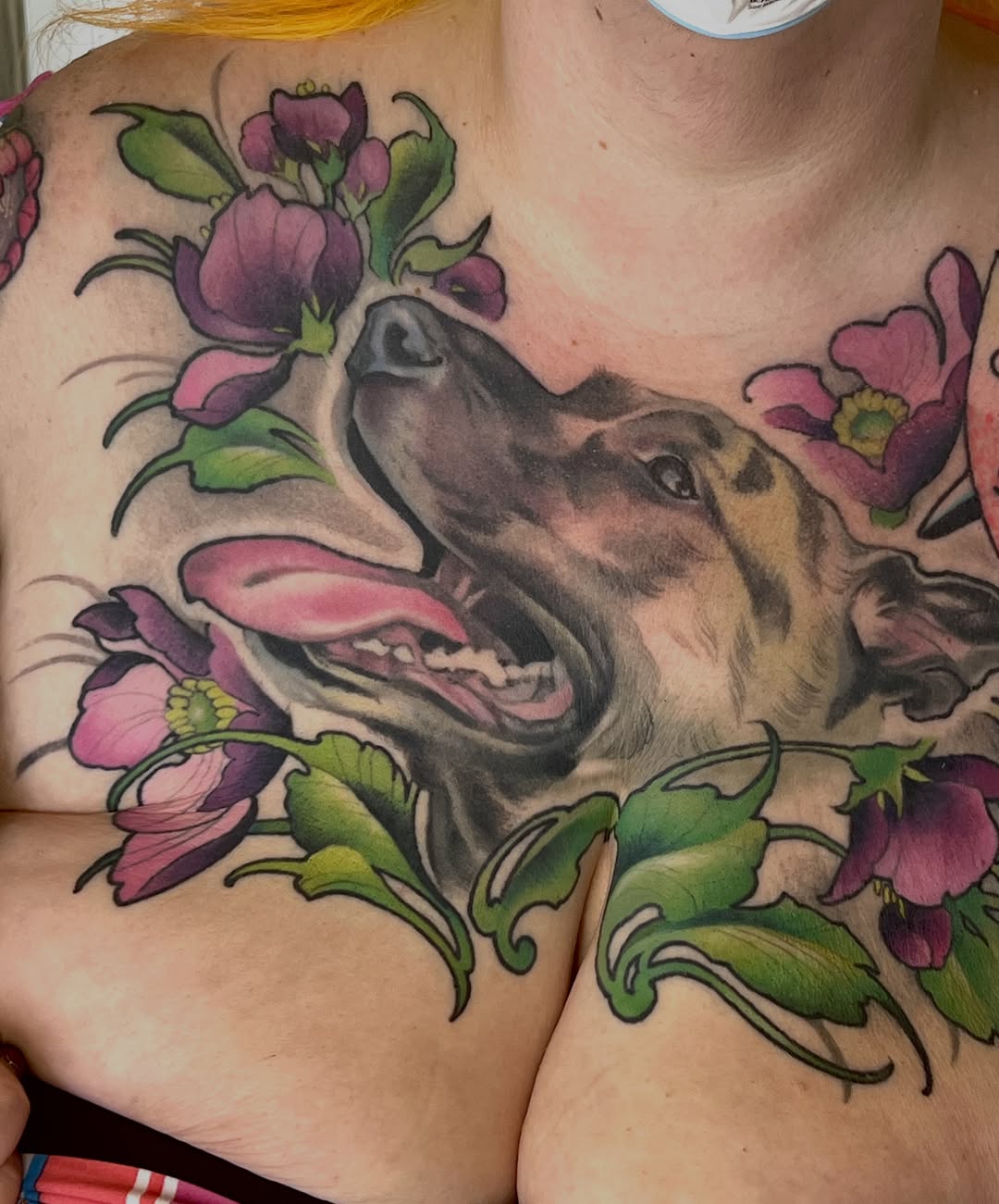 Dog portrait with flowers neo-traditional tattoo on the chest by Tex Buss, San Francisco, California