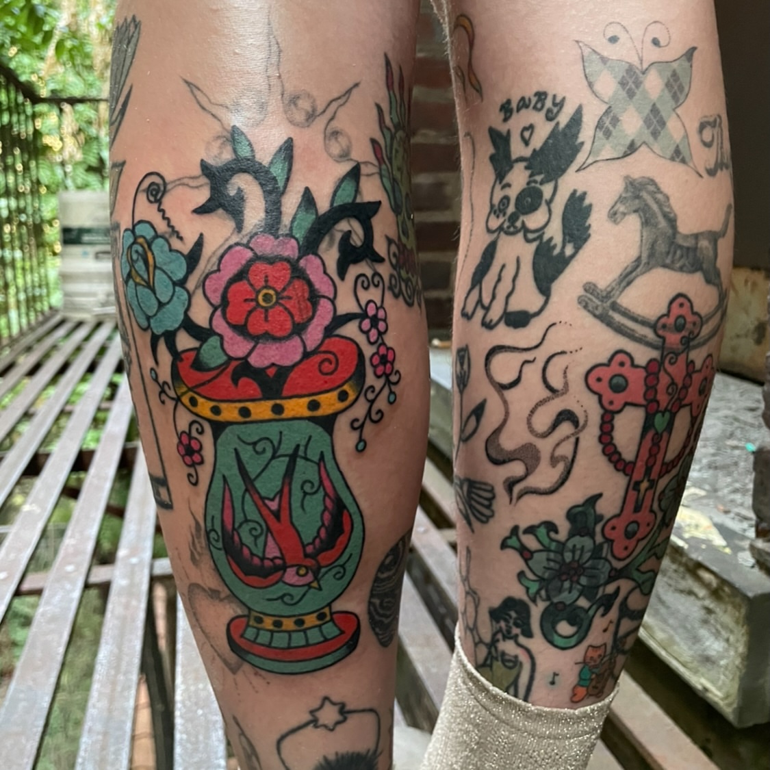 Vase with flowers American traditional tattoo on the leg by zoe ๐