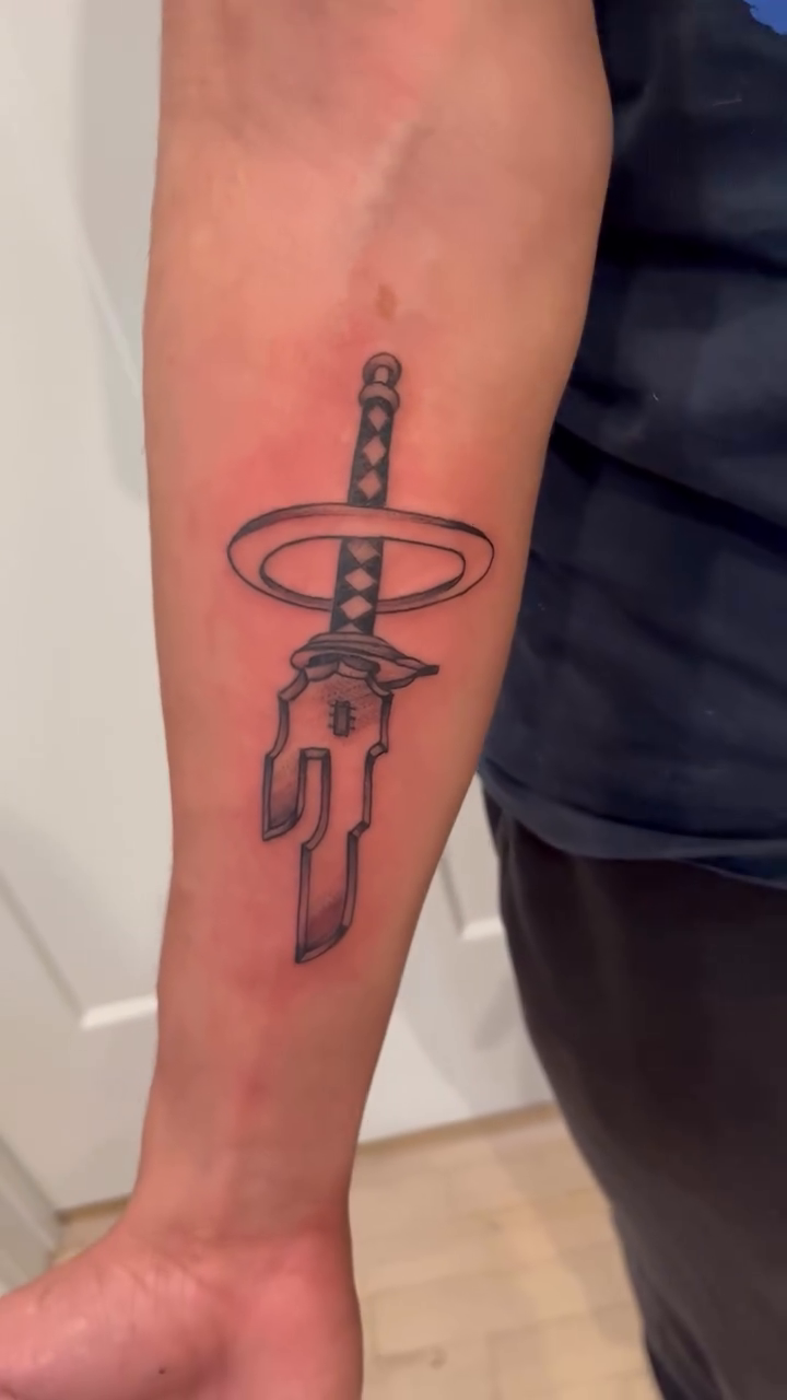 Sword with halo cyber sigilism tattoo on the forearm by DL Tats, Cape Girardeau, Missouri
