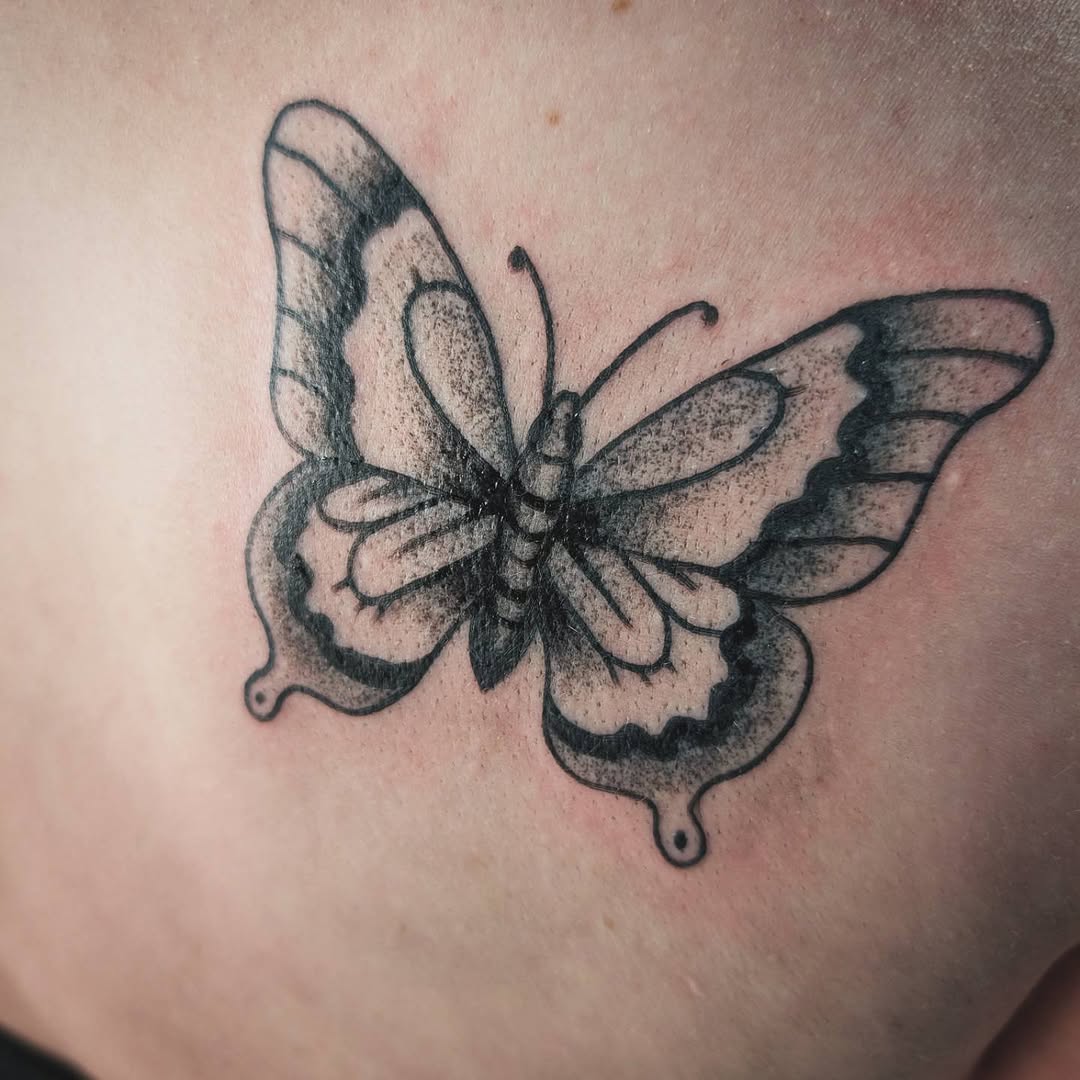 Butterfly fine line tattoo on the chest by Matt Mahl