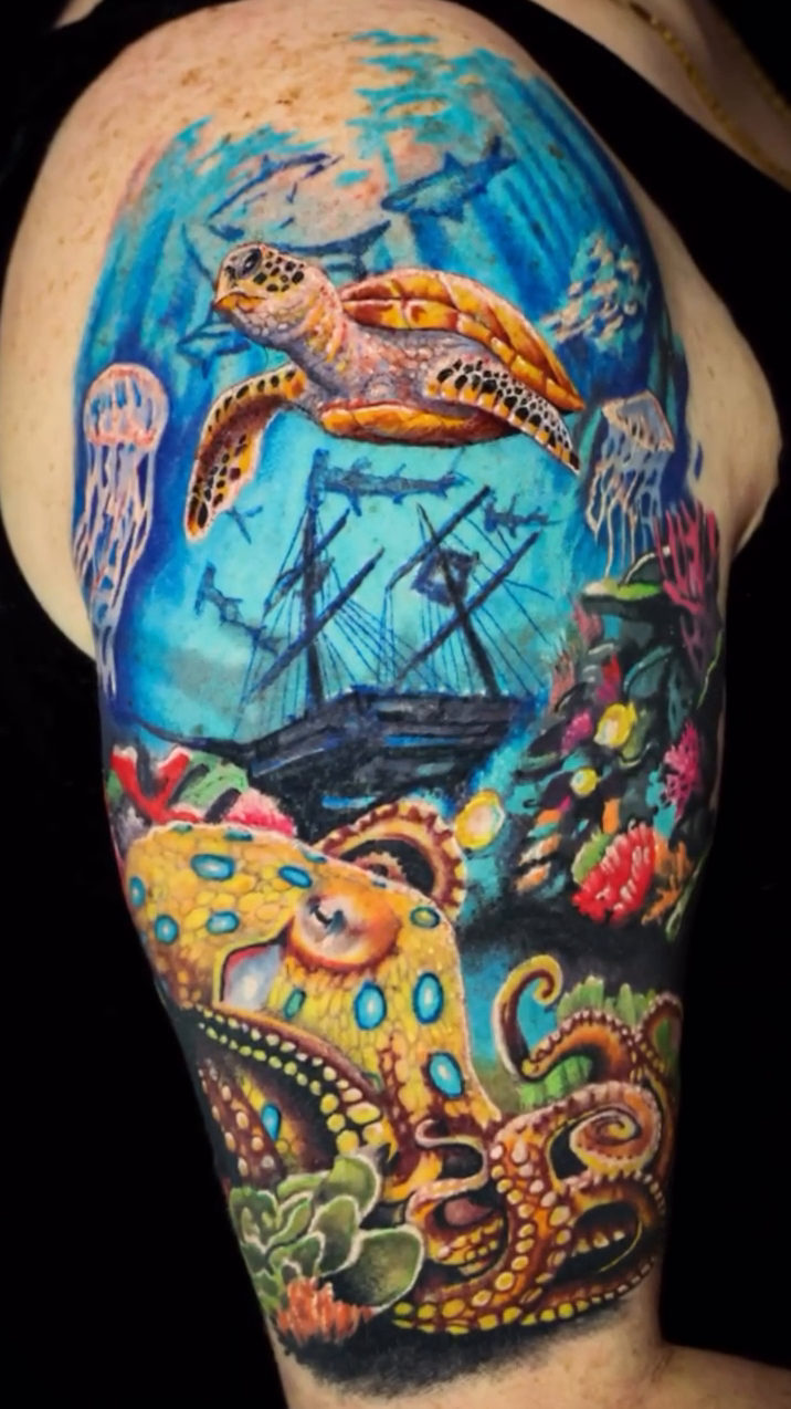 Watercolor tattoo on the upper arm by Matt Trimble, Charlotte, North Carolina