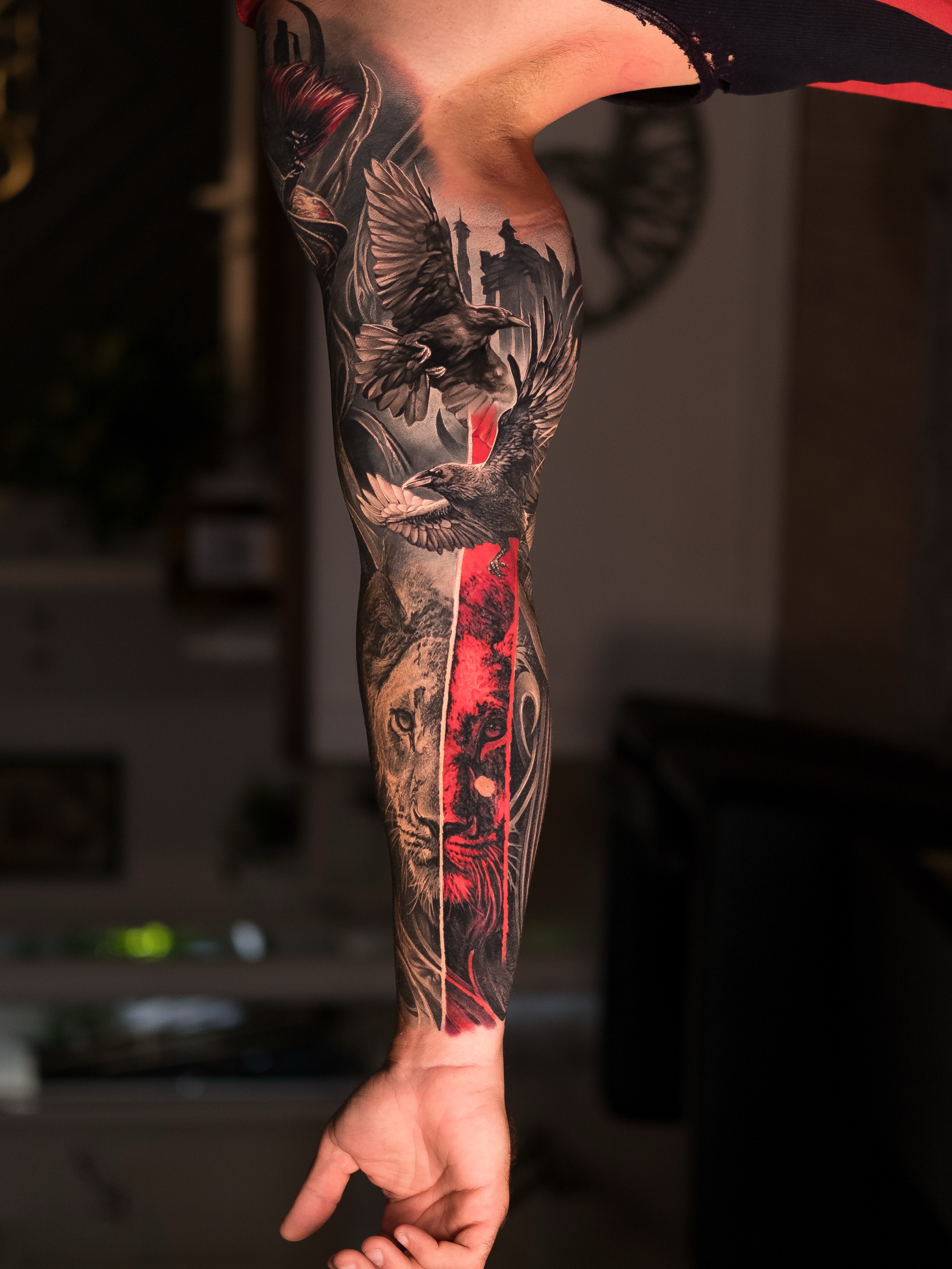 Lion and birds realism tattoo on the forearm by Christopher Powell