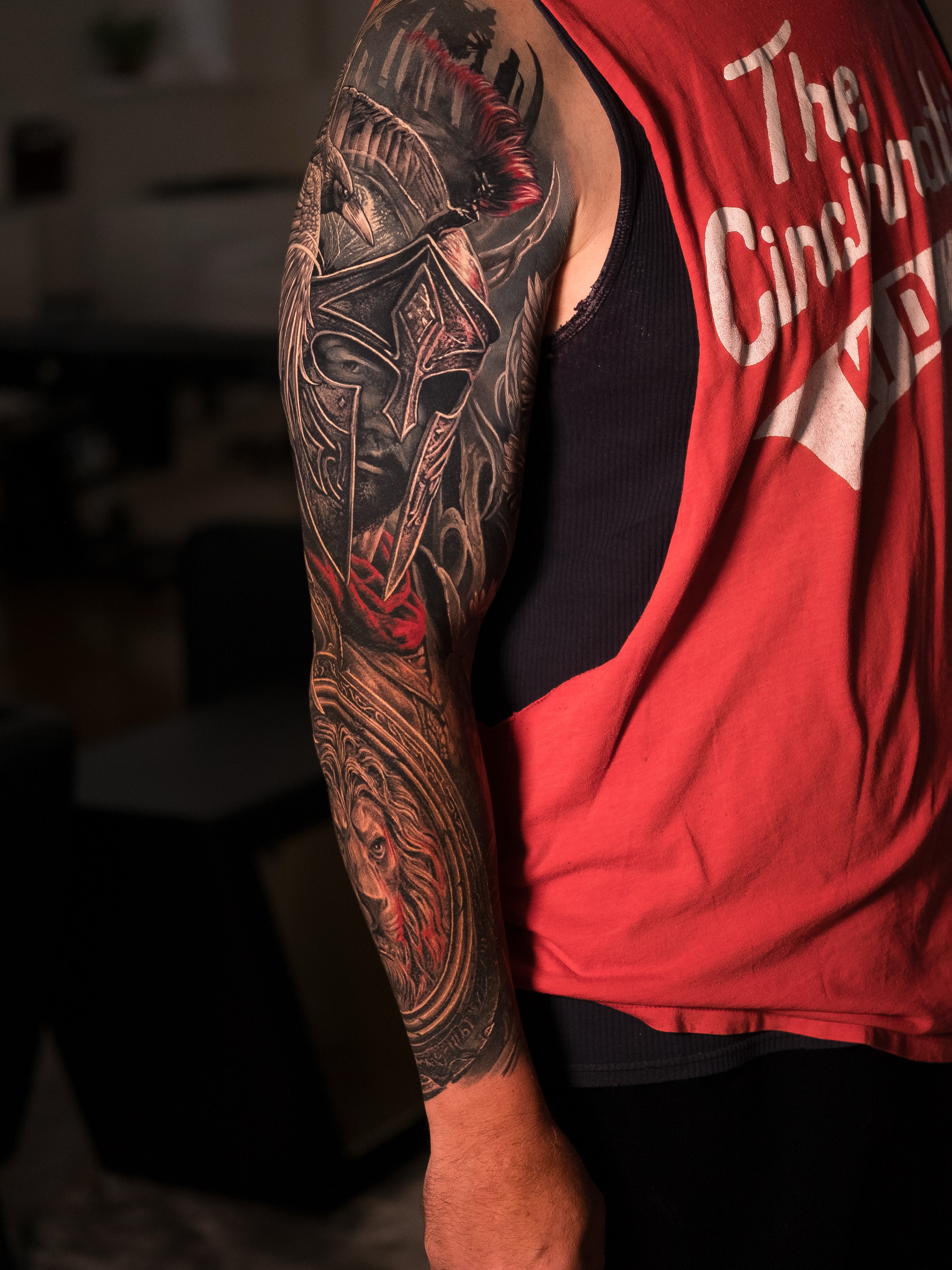 Spartan warrior and lion Japanese tattoo on the upper arm by Christopher Powell