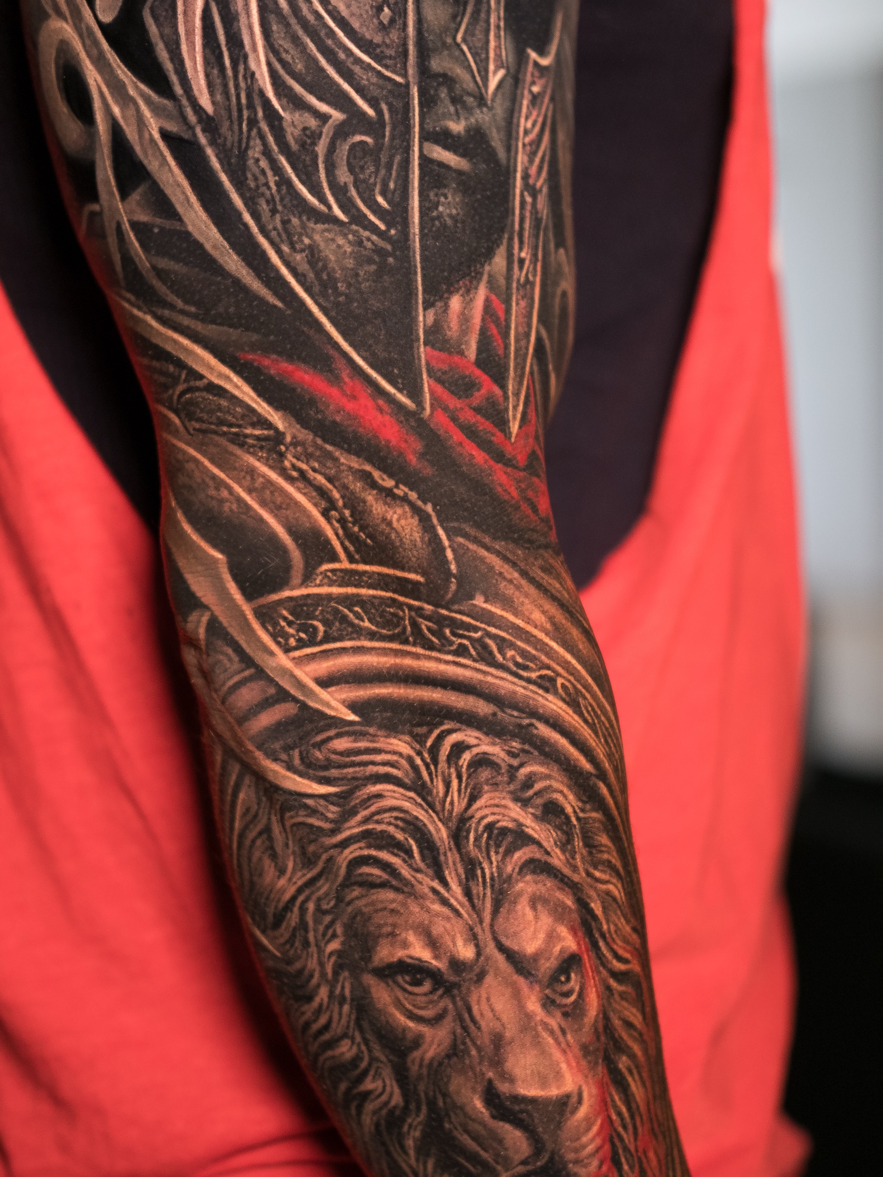 Lion and armor Japanese tattoo on the forearm by Christopher Powell