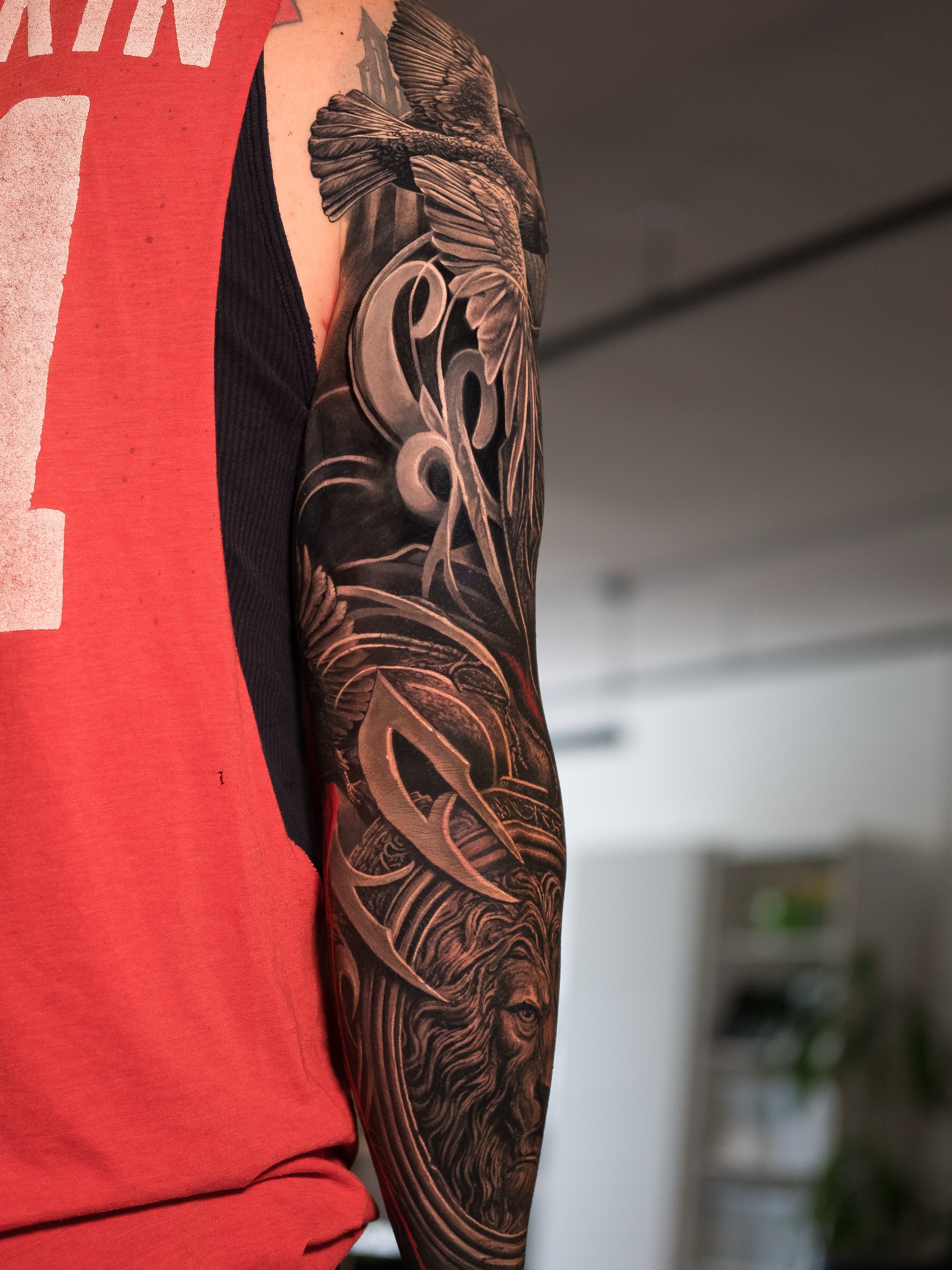 Lion and eagle sleeve Japanese tattoo on the forearm by Christopher Powell