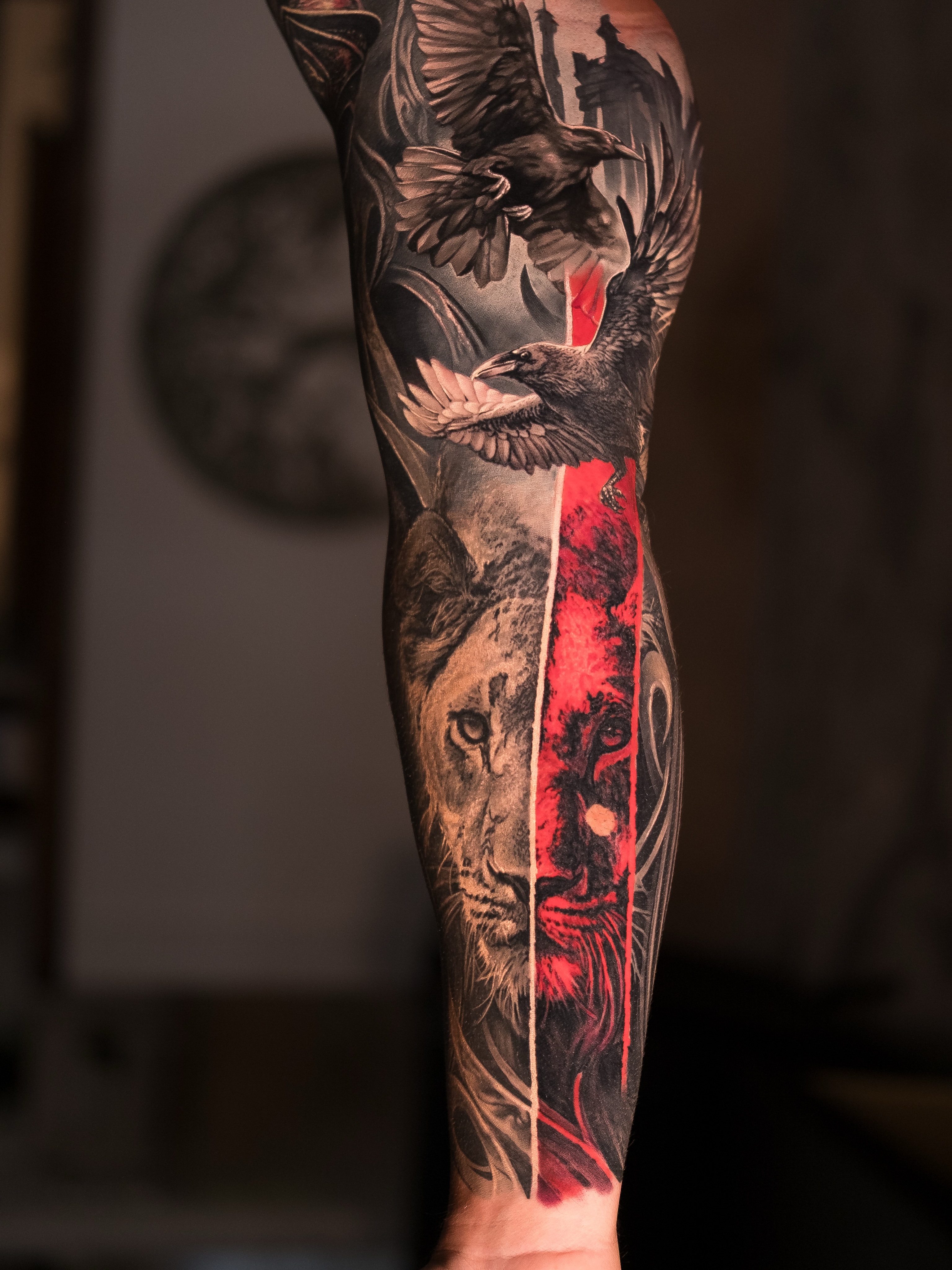 Lion and ravens realism tattoo on the forearm by Christopher Powell