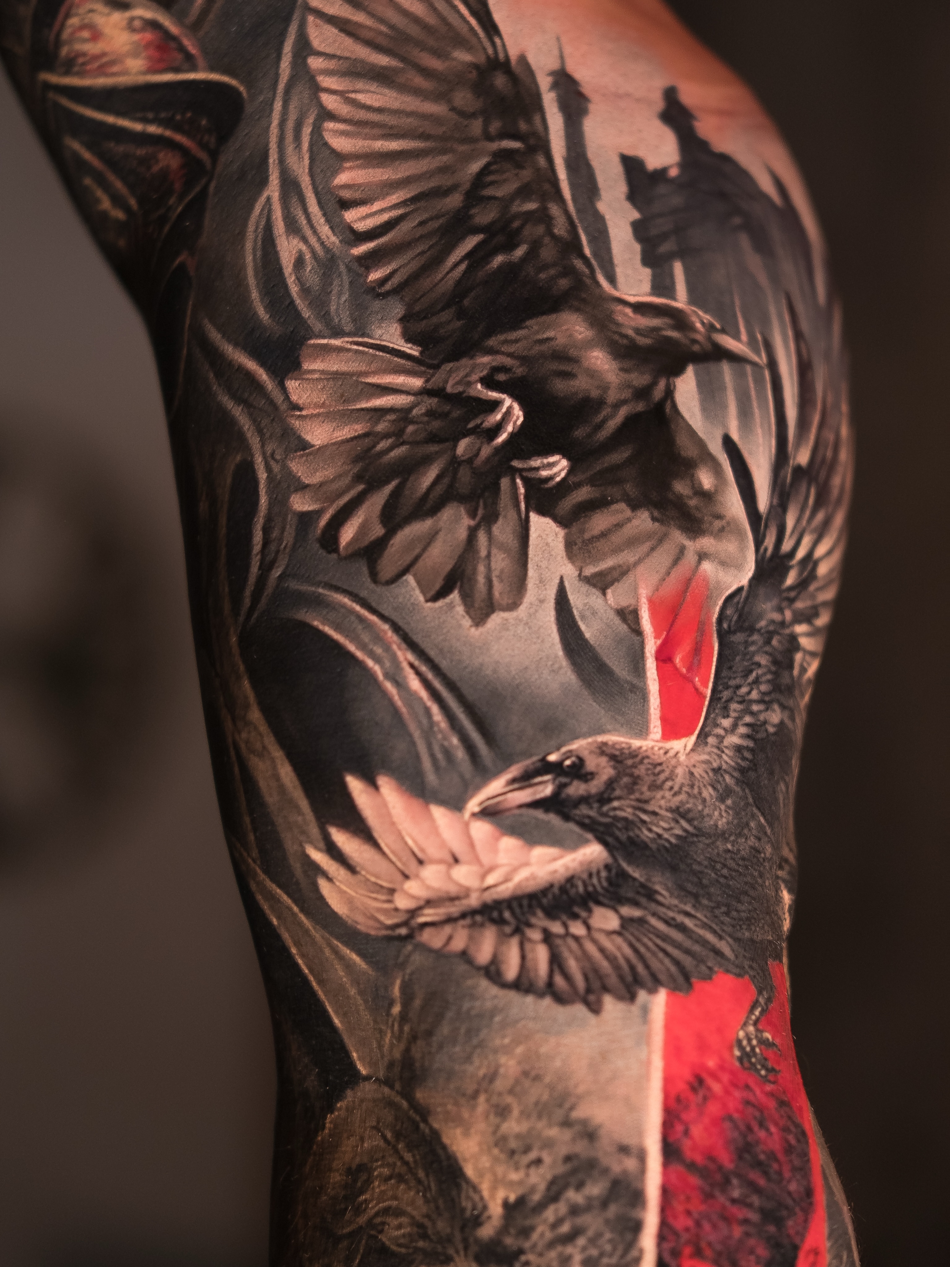 Ravens in flight realism tattoo on the forearm by Christopher Powell