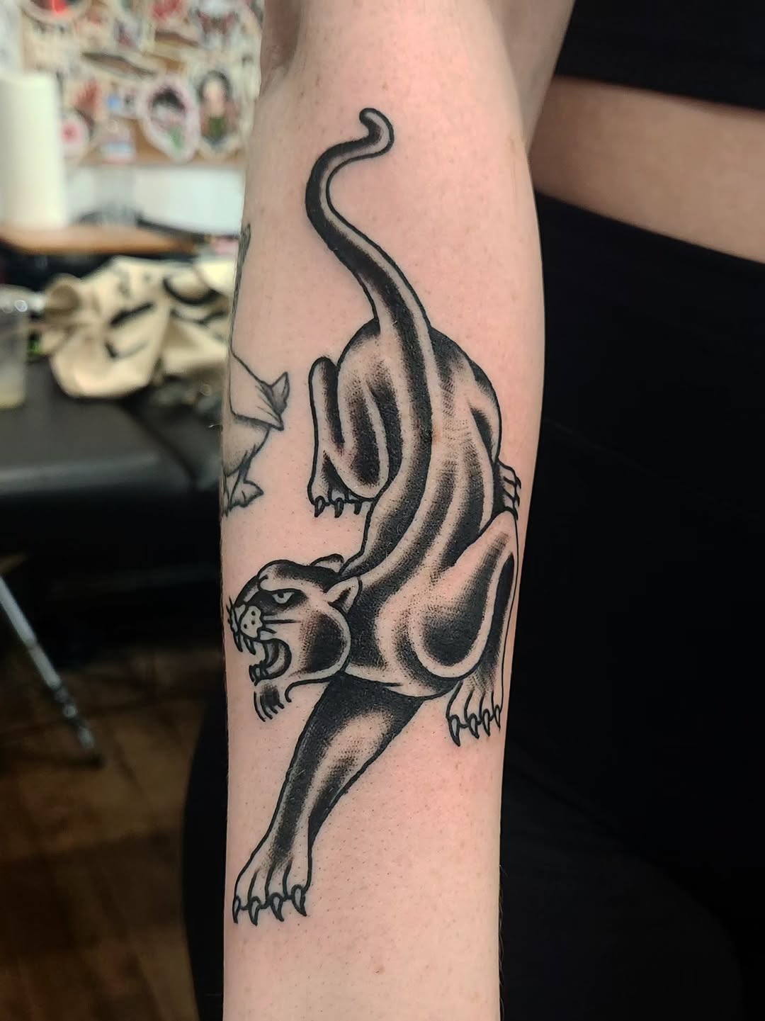 Panther realism tattoo on the forearm by Douglas Grady
