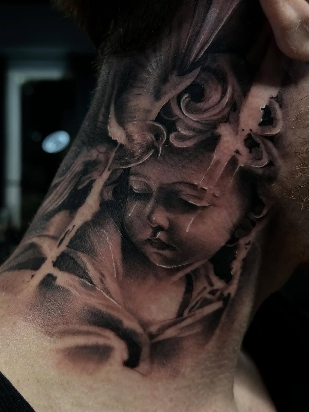 Cherub with wings realism tattoo on the shoulder by Dallas Corsmeier