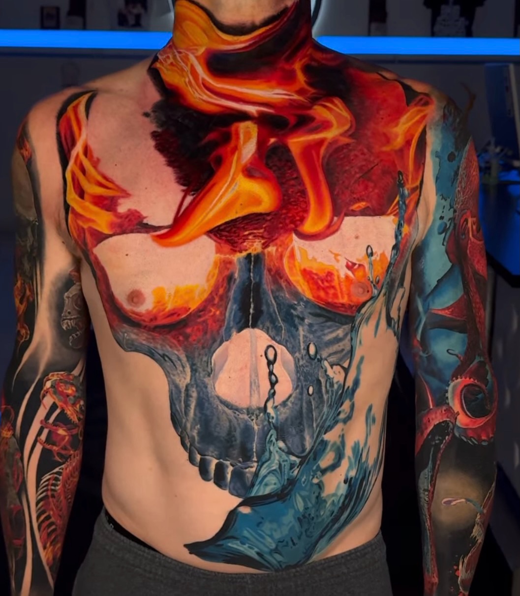 Skull with fire and water surrealism tattoo on the torso by B R A D C H A R L e S