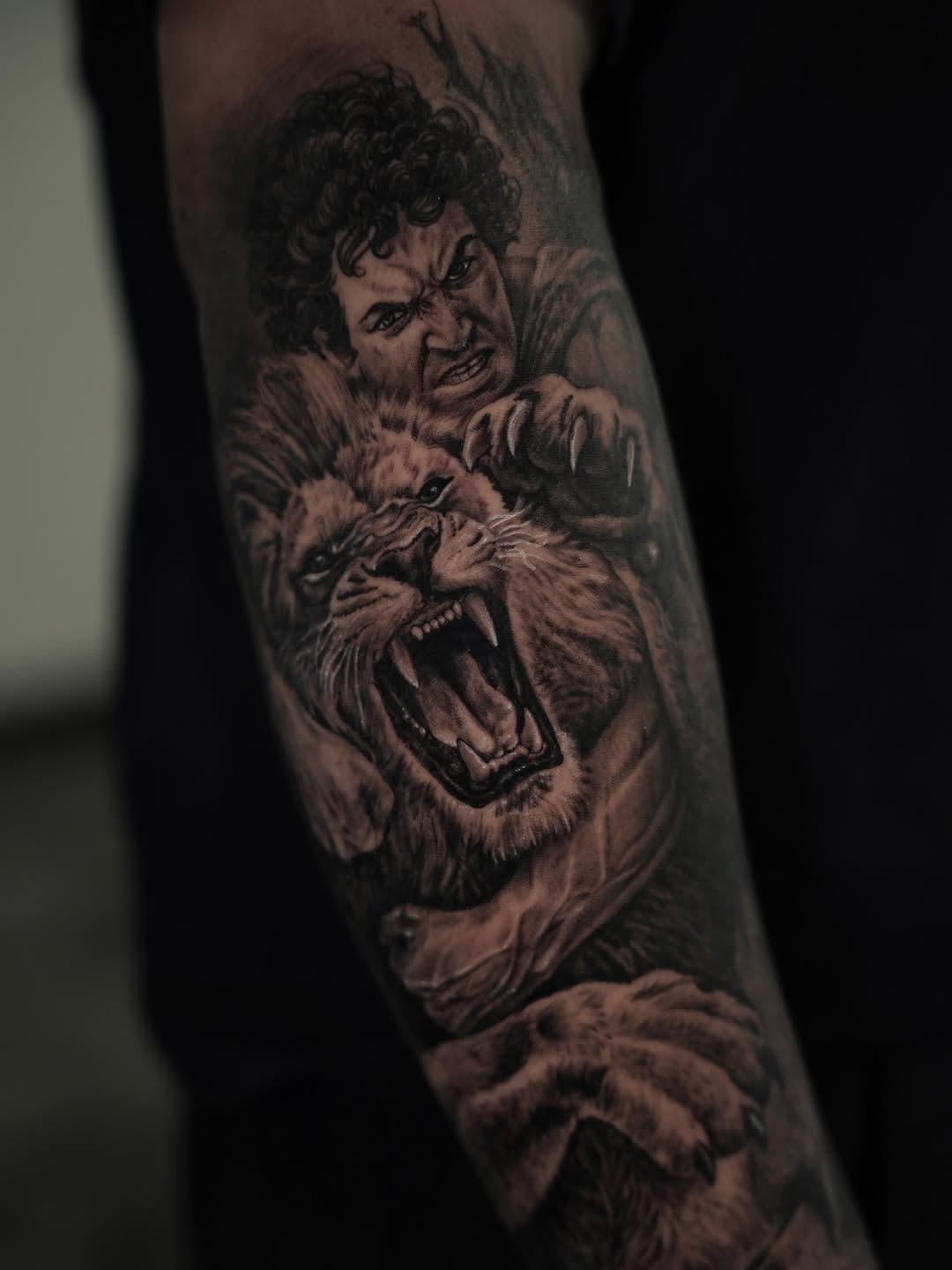 Man fighting a lion surrealism tattoo on the forearm by Nelson Tellez