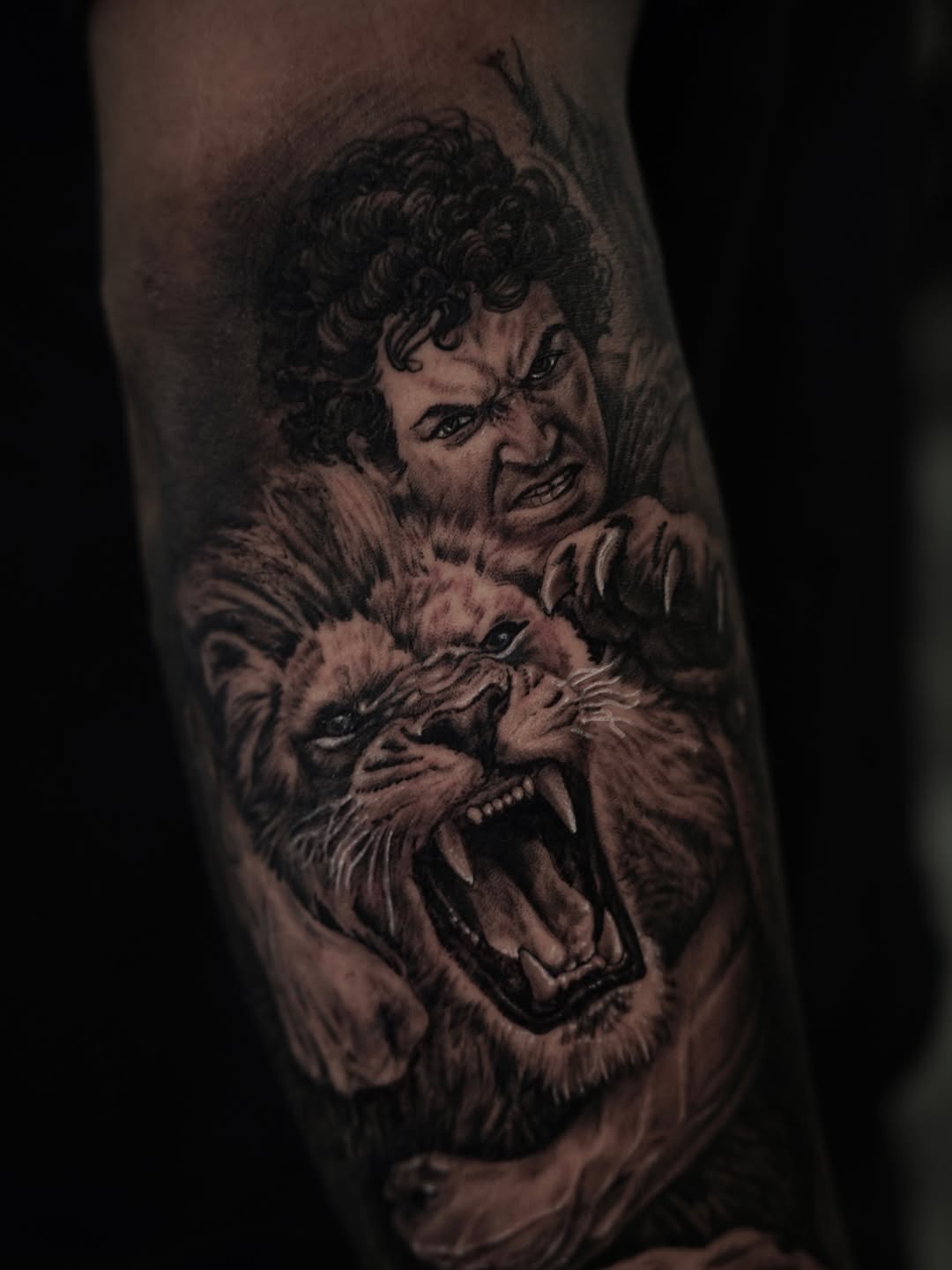 Man fighting a lion surrealism tattoo on the forearm by Nelson Tellez