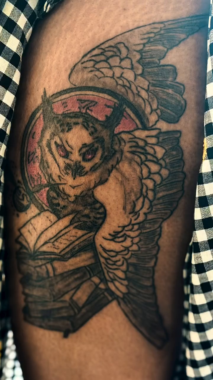 Owl with books tattoo on the thigh by Lopez Dautruche