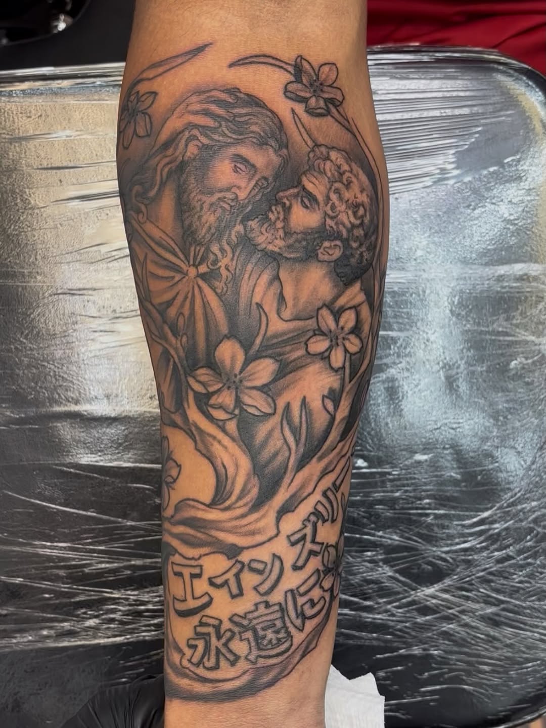Jesus and Peter Chicano tattoo on the forearm by Sam Hearnen, Lawrence, Kansas