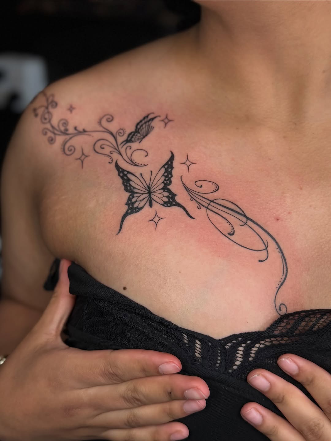 Butterfly and floral vine fine line tattoo on the chest by Jocelyne ♡