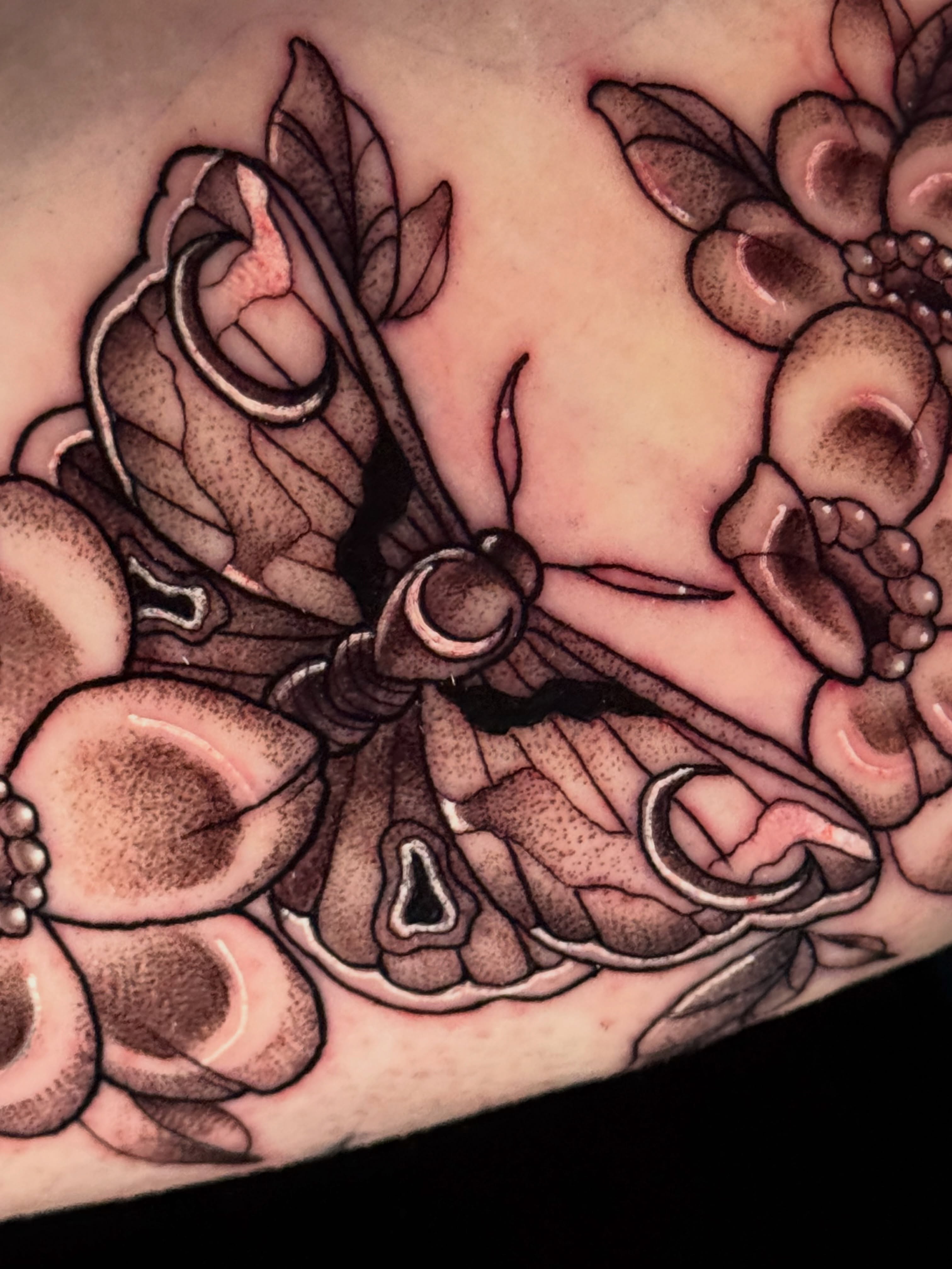 Butterfly and flowers realism tattoo on the forearm by tori 🫶🏻