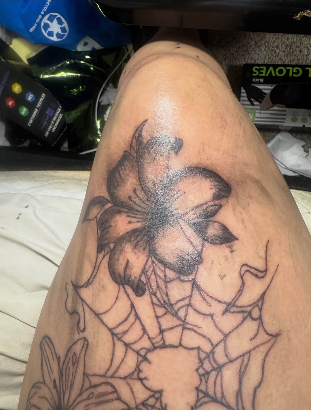 Lily and spiderweb fine line tattoo on the thigh by ❤️Jesselli ison ❤️