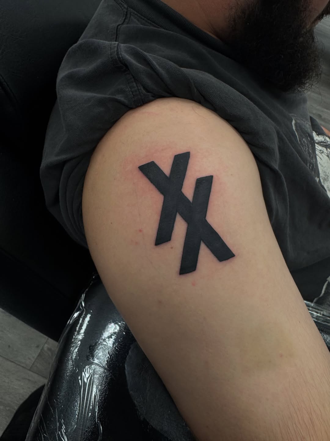 XX symbol cyber sigilism tattoo on the shoulder by Israel Jacob Woehler