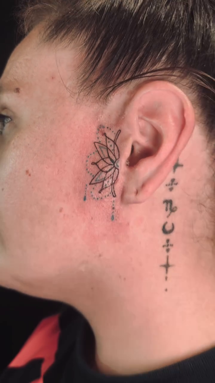 Lotus flower and celestial symbols ornamental tattoo on the neck by Erik Pagtakhan