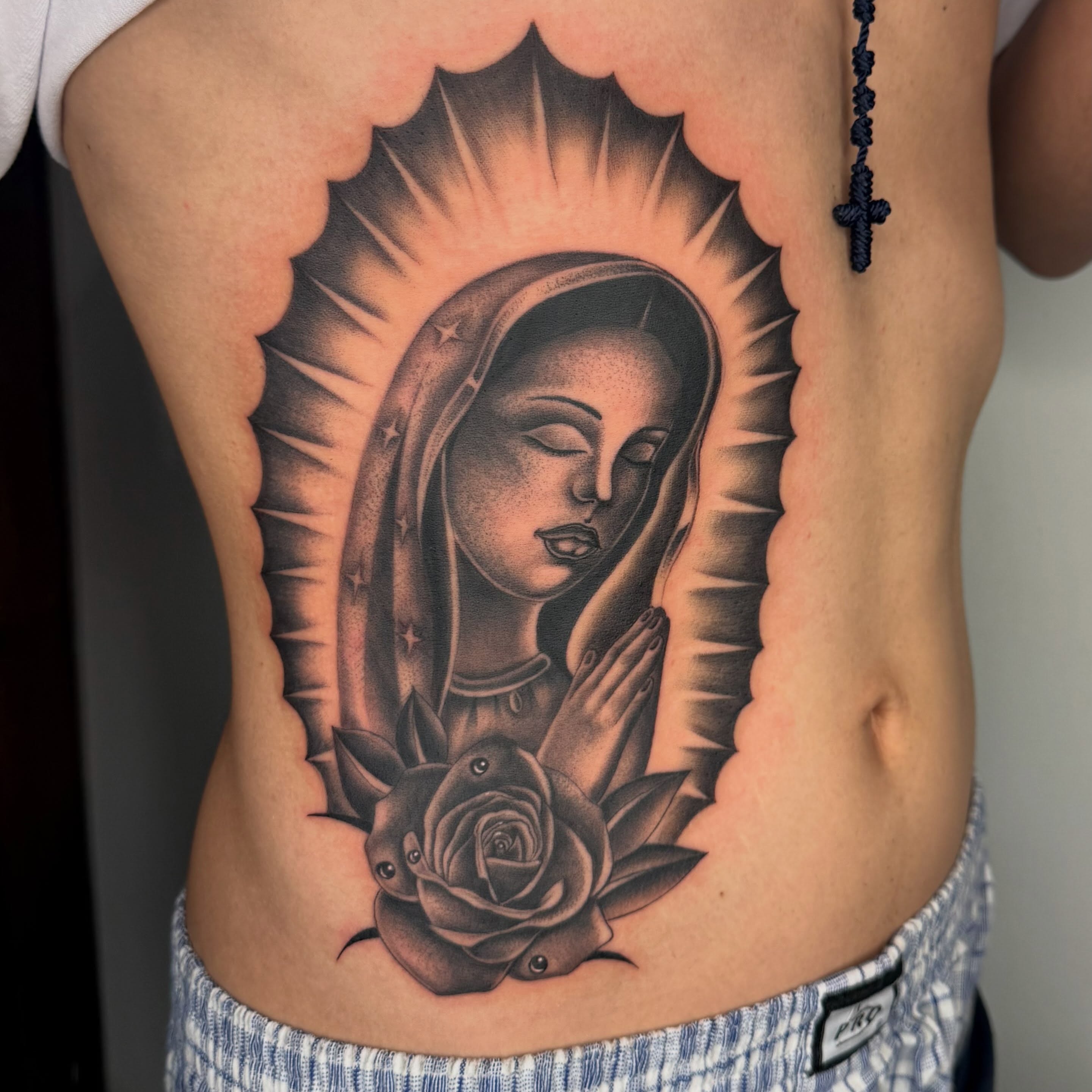 Virgin mary black and grey tattoo on the ribs by H e I D I
