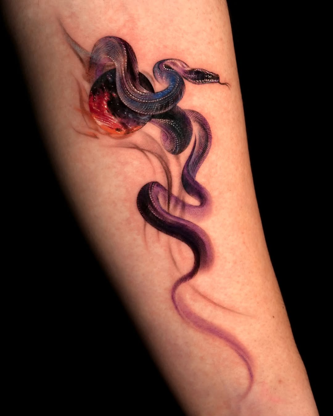 Snake and celestial body surrealism tattoo on the forearm by Rizn