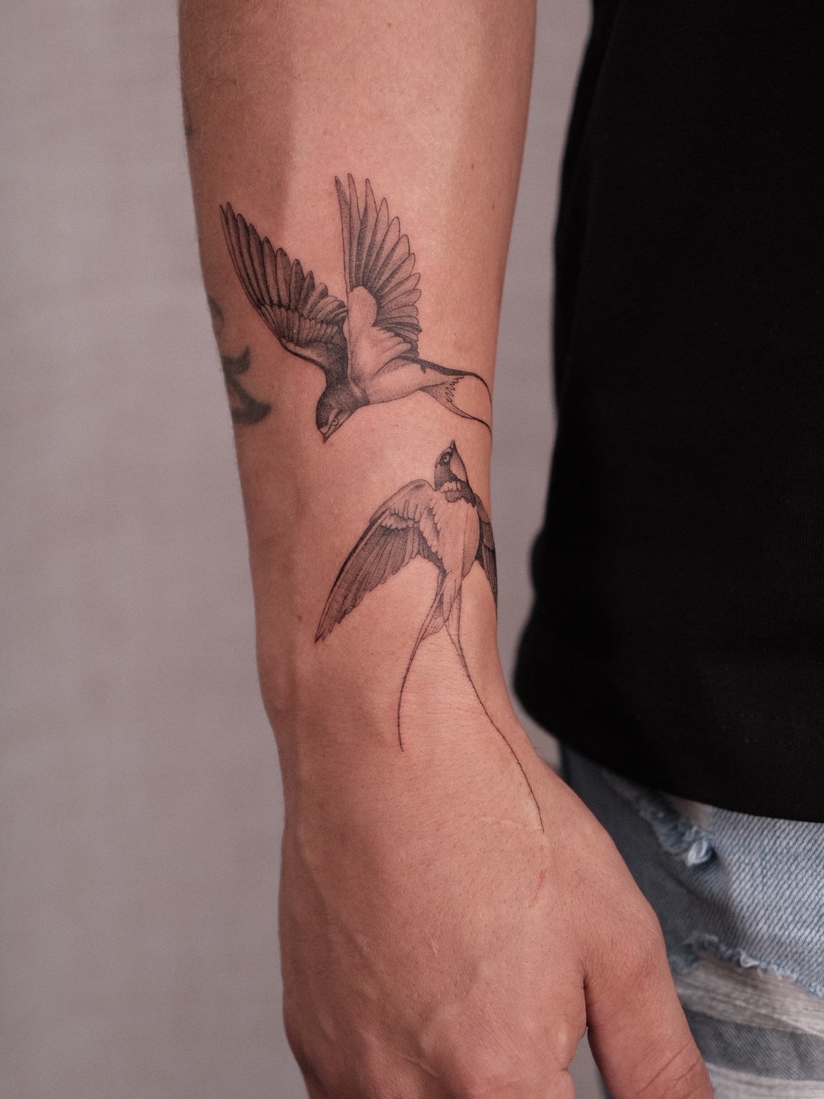 Birds black and grey tattoo on the forearm by Houston Tattoo Artist GoldenK