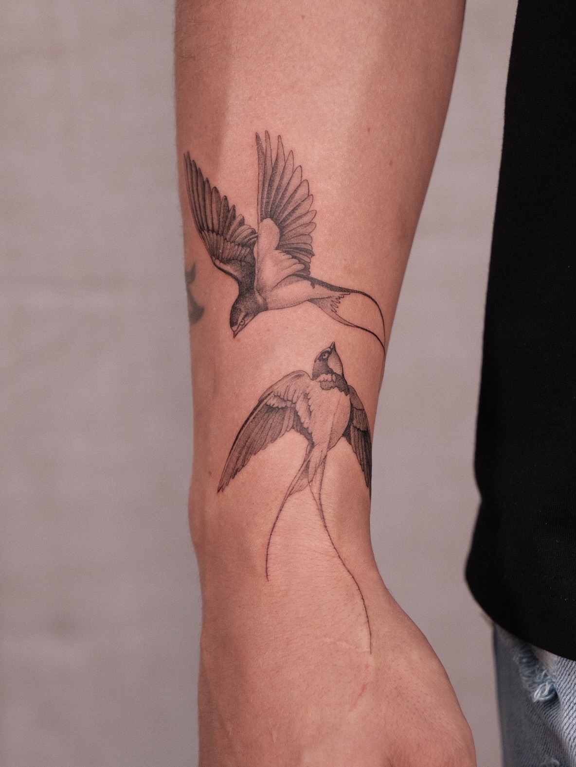 Birds black and grey tattoo on the forearm by Houston Tattoo Artist GoldenK